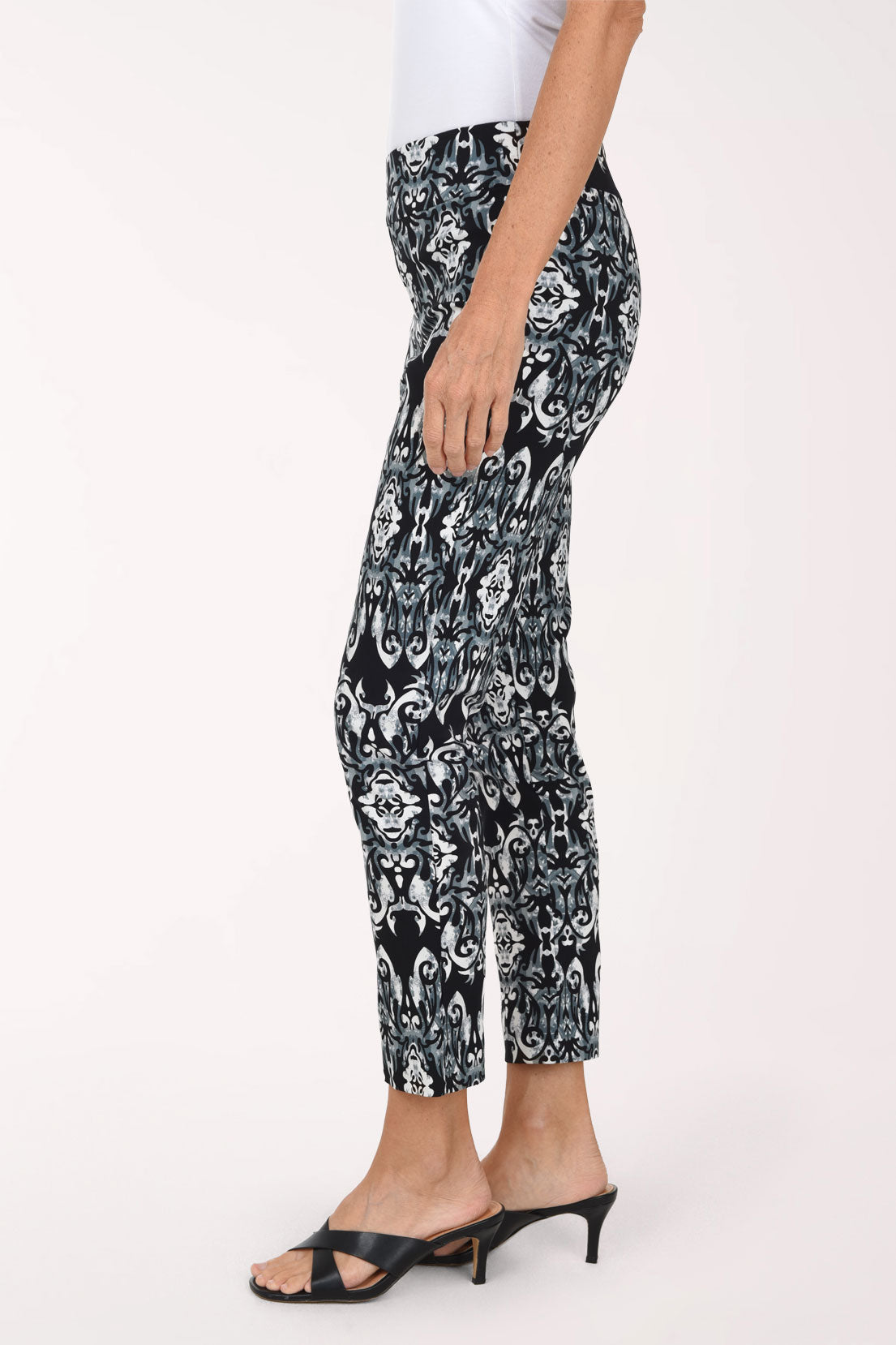 Women wearing a black mosaic printed pull-on ankle pants