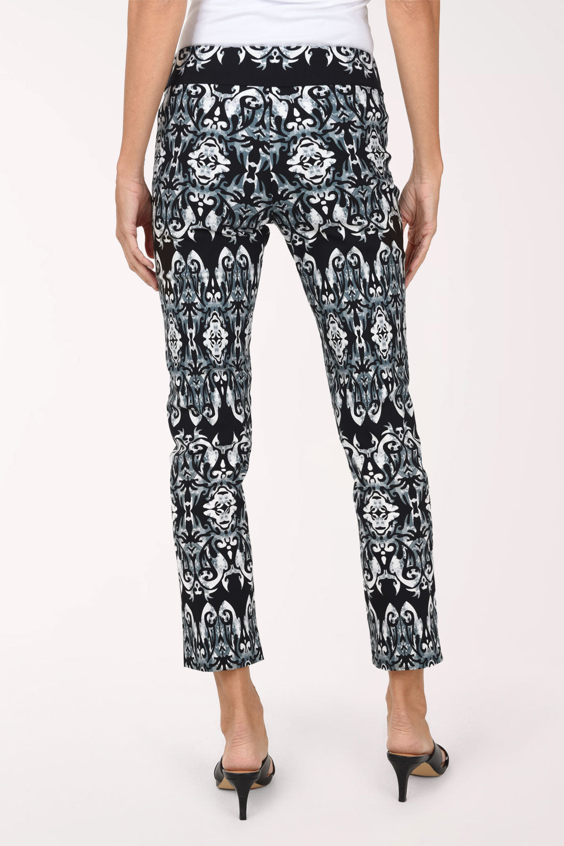 Women wearing a black mosaic printed pull-on ankle pants