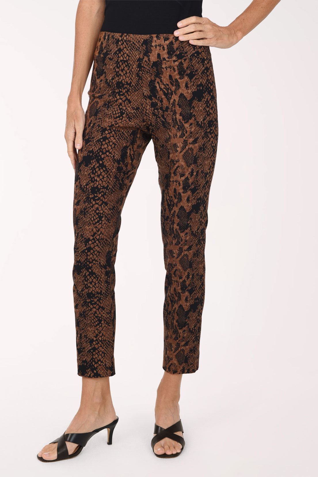 Women wearing brown python printed pull-on ankle pants