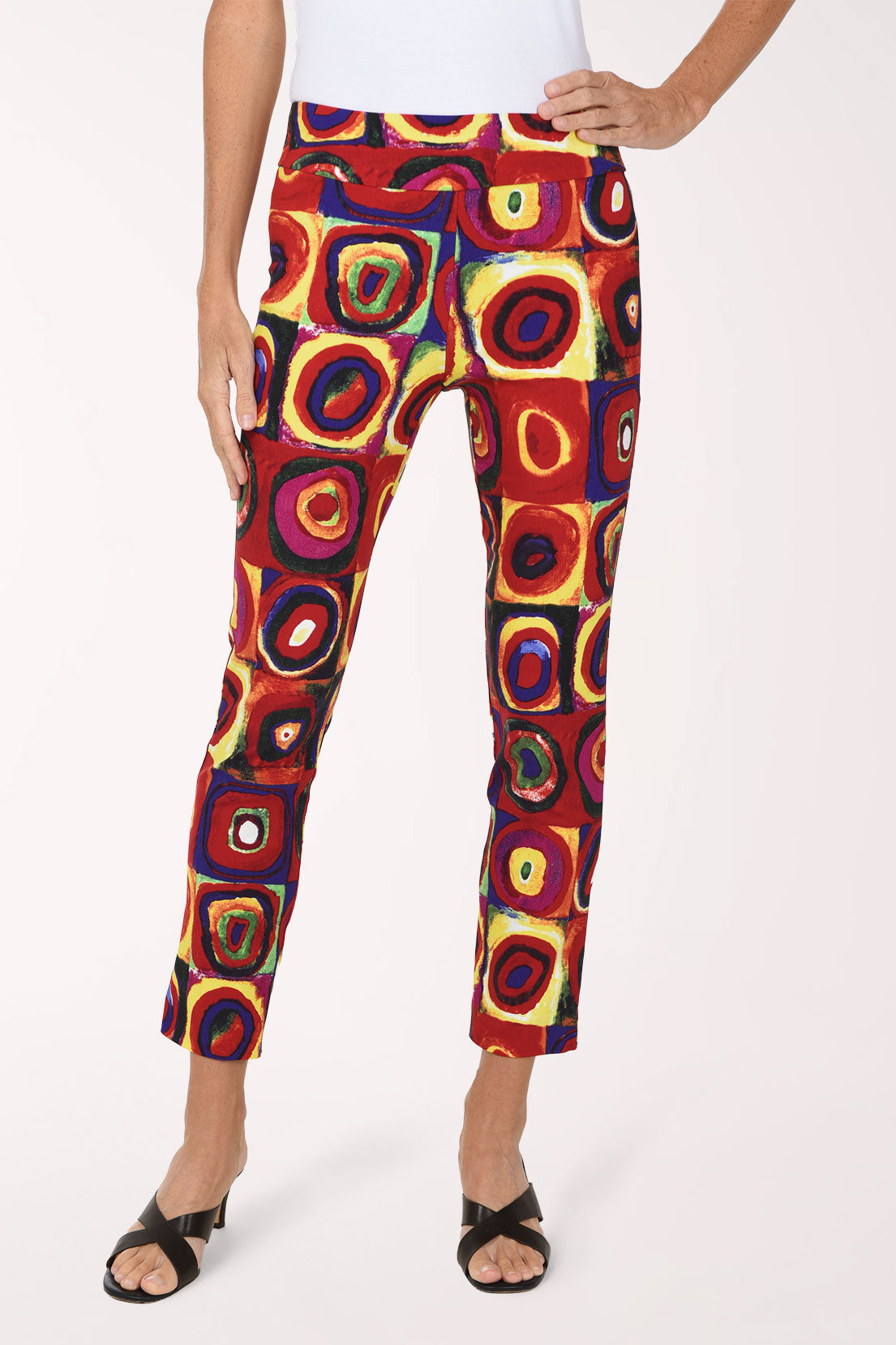 Women wearing a multicolored square and circular print pull-on ankle pants