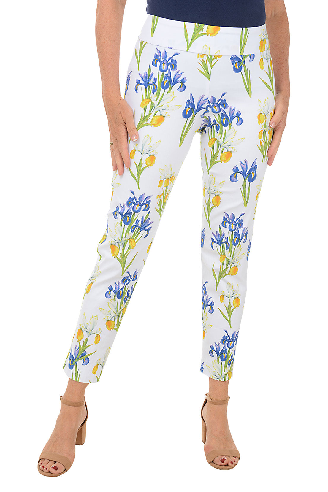 A front shot of a model wearing a pair of pull-on ankle pants with an elasticized waistband, featuring a white base with a blue and yellow floral pattern.