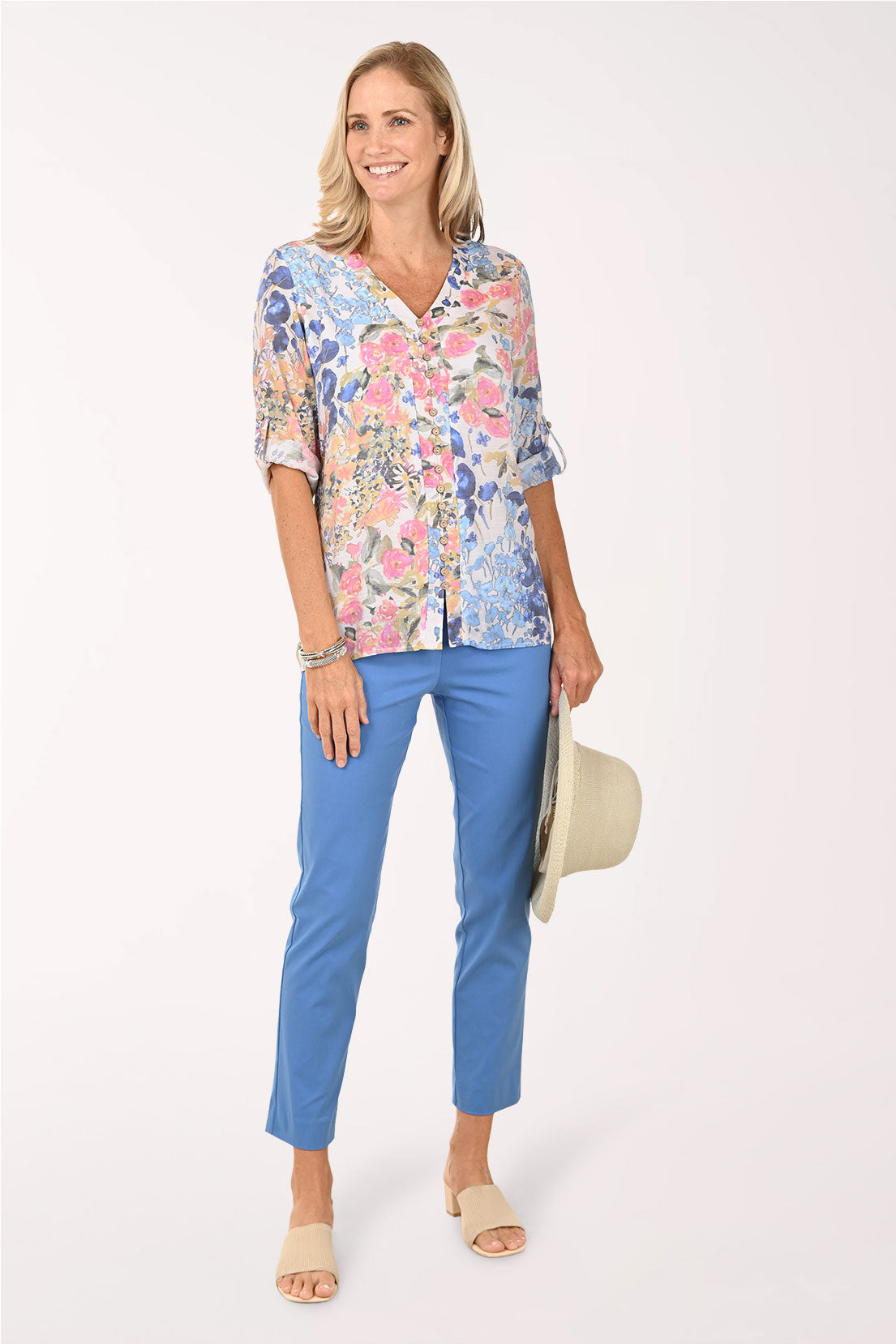 Person wearing blue pants on a white background