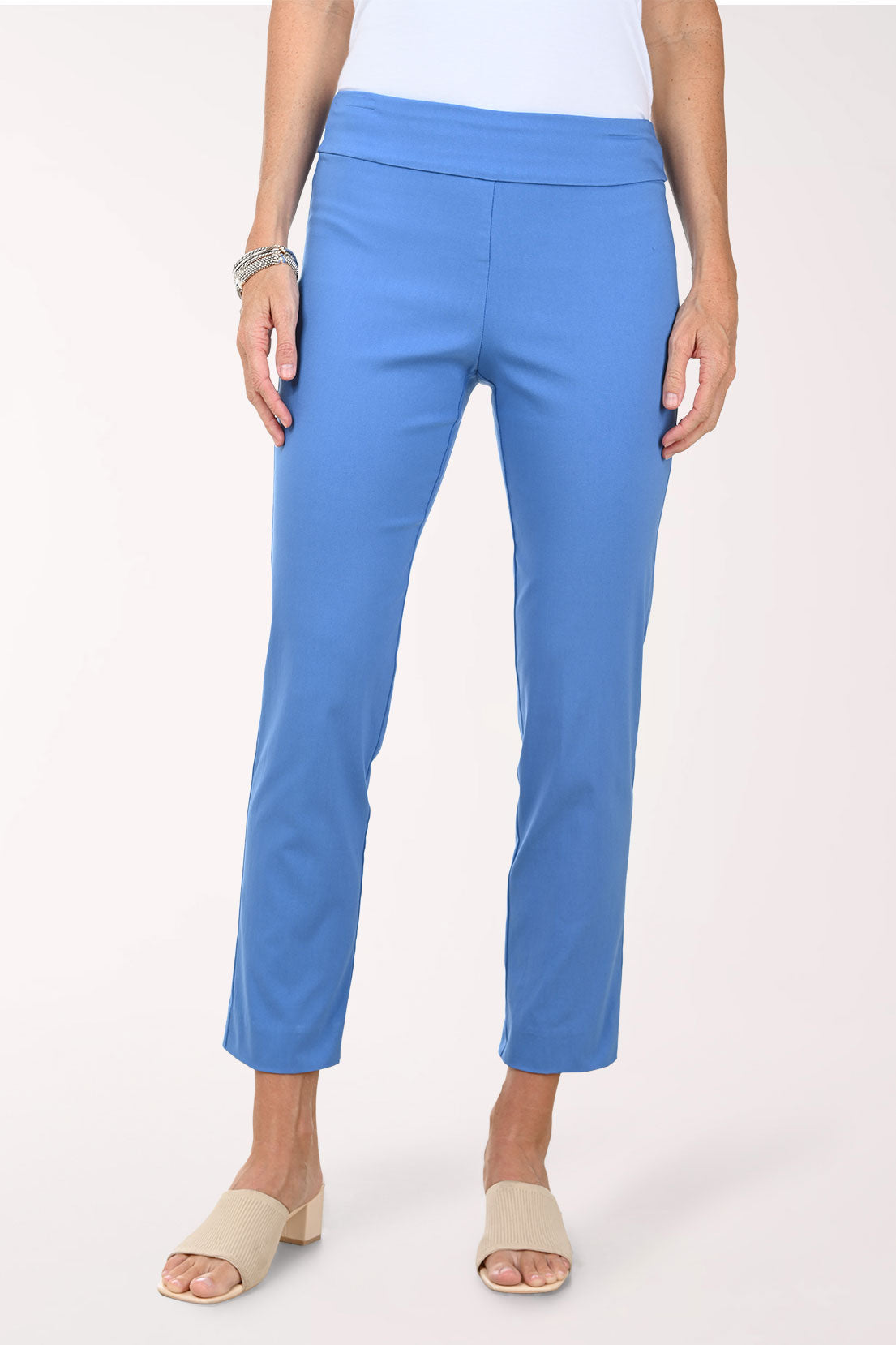 Person wearing blue pants on a white background