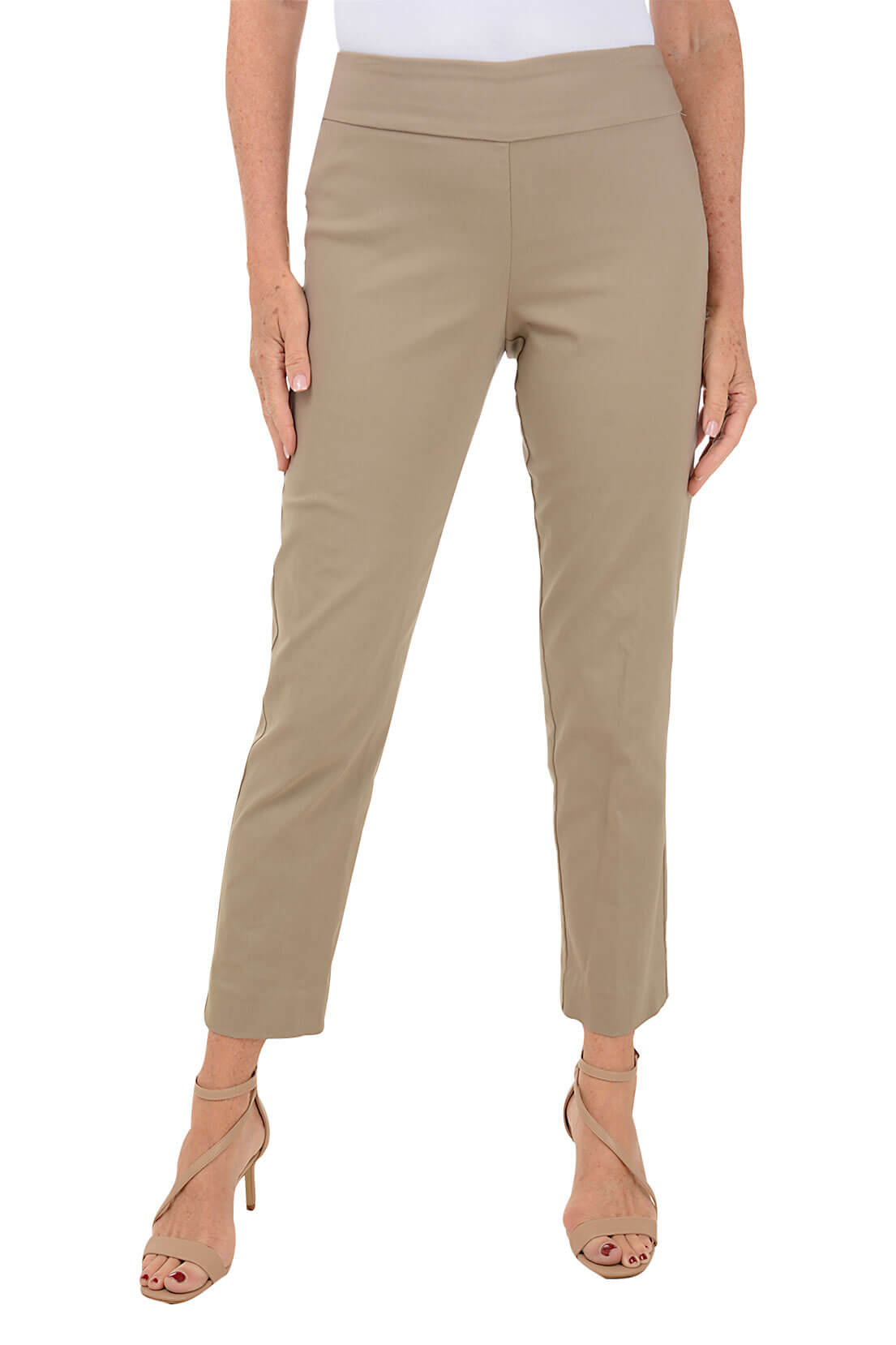 A front shot of a model wearing a taupe pull-on ankle pant with a white top and beige wedges.