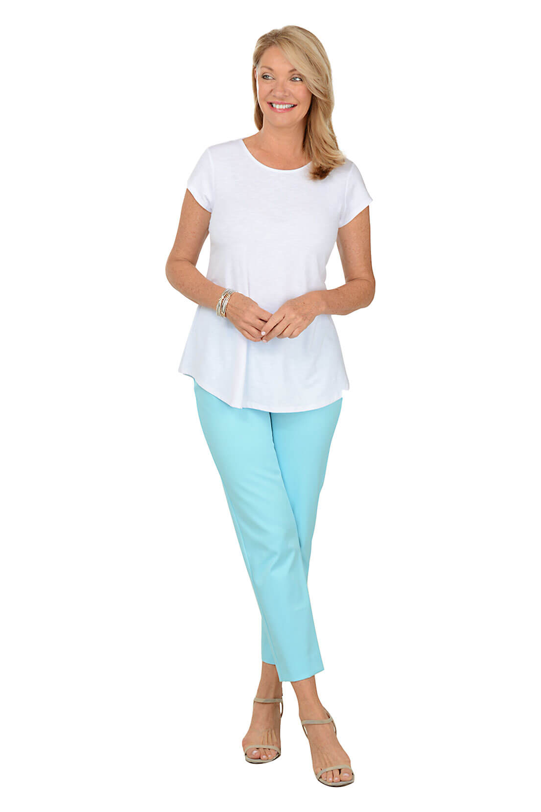 A full length shot of a model wearing a aqua blue textured pull-on ankle pants with a mid-rise waist and slim fit.
