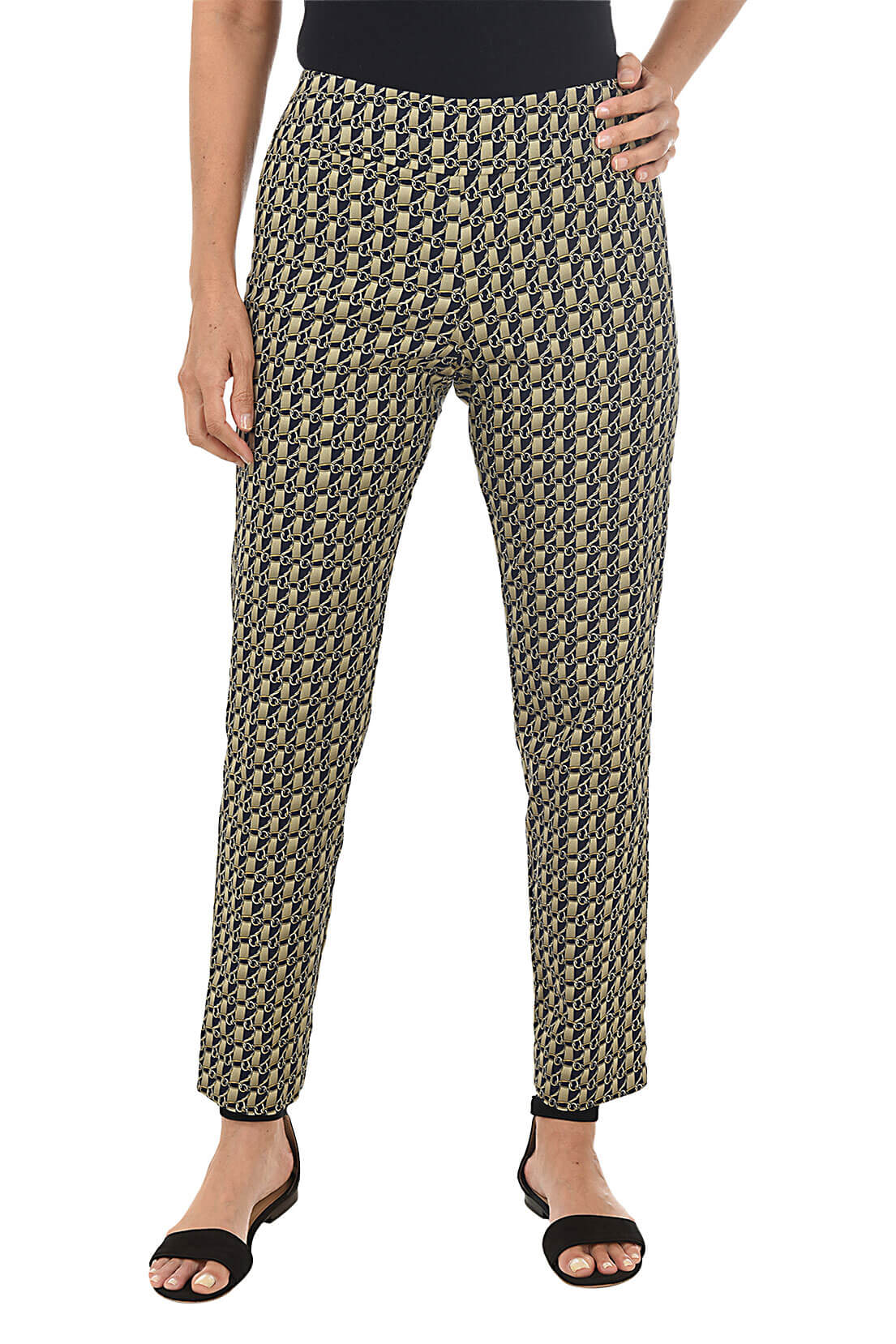 A front shot of a model wearing a pair of slim-fit golden link print pull-on ankle pants with an elasticized waistband, made from a blend of nylon, rayon, and spandex fabrics.