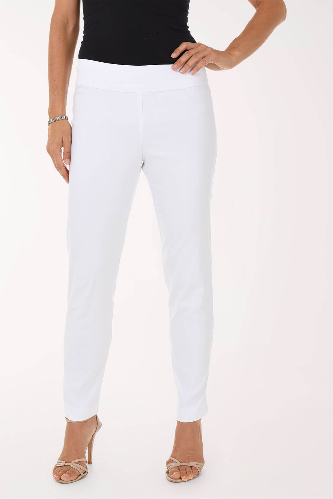 Person wearing white pants and a black top on a white background
