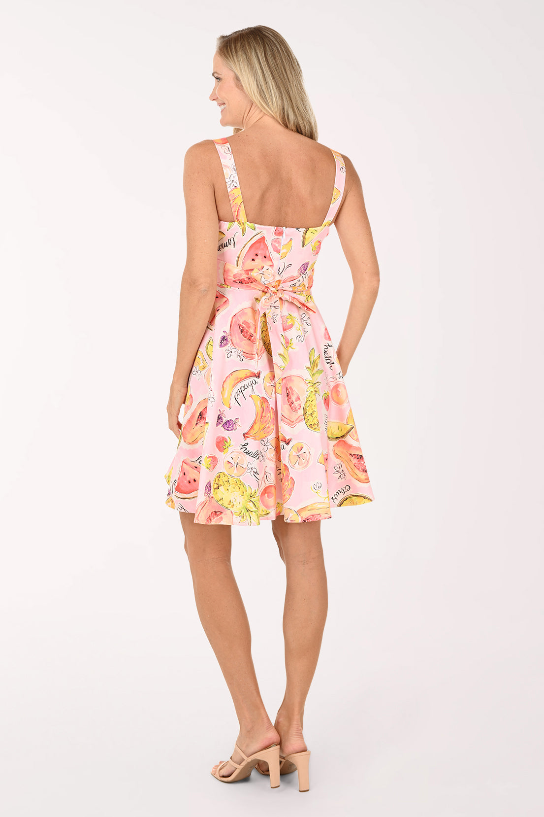 Woman wearing a floral dress on a white background