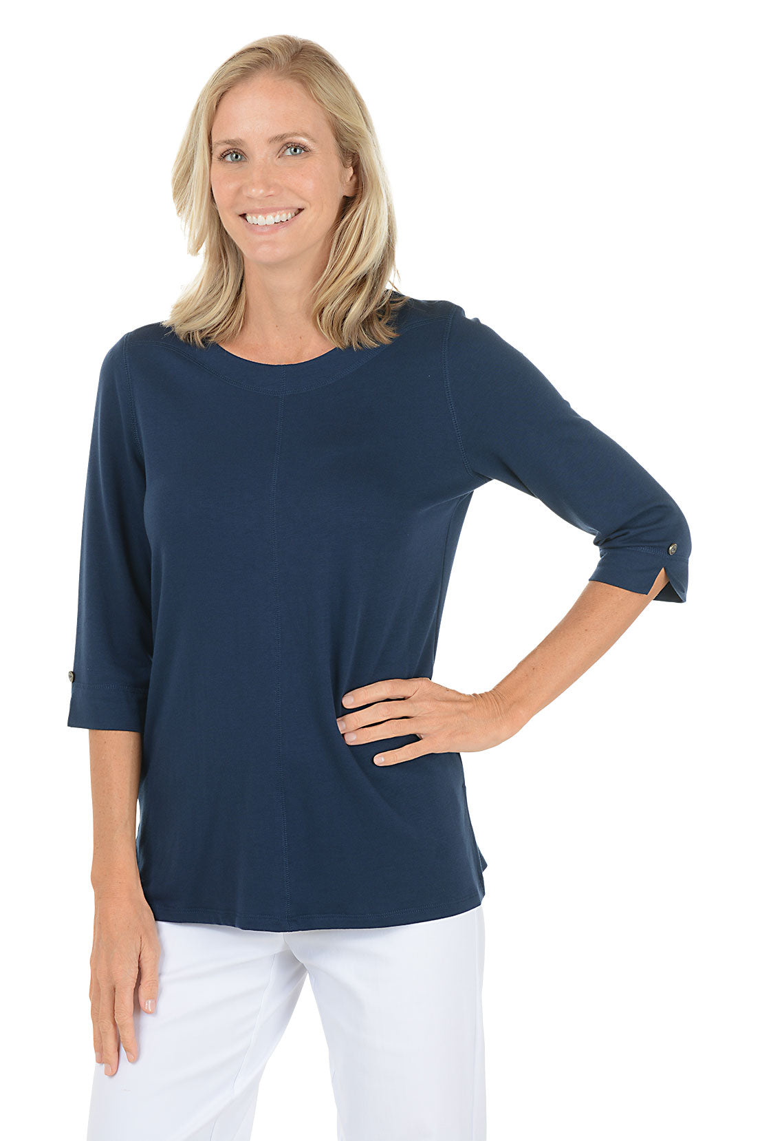 Woman wearing a navy blue top with rolled-up sleeves on a white background.