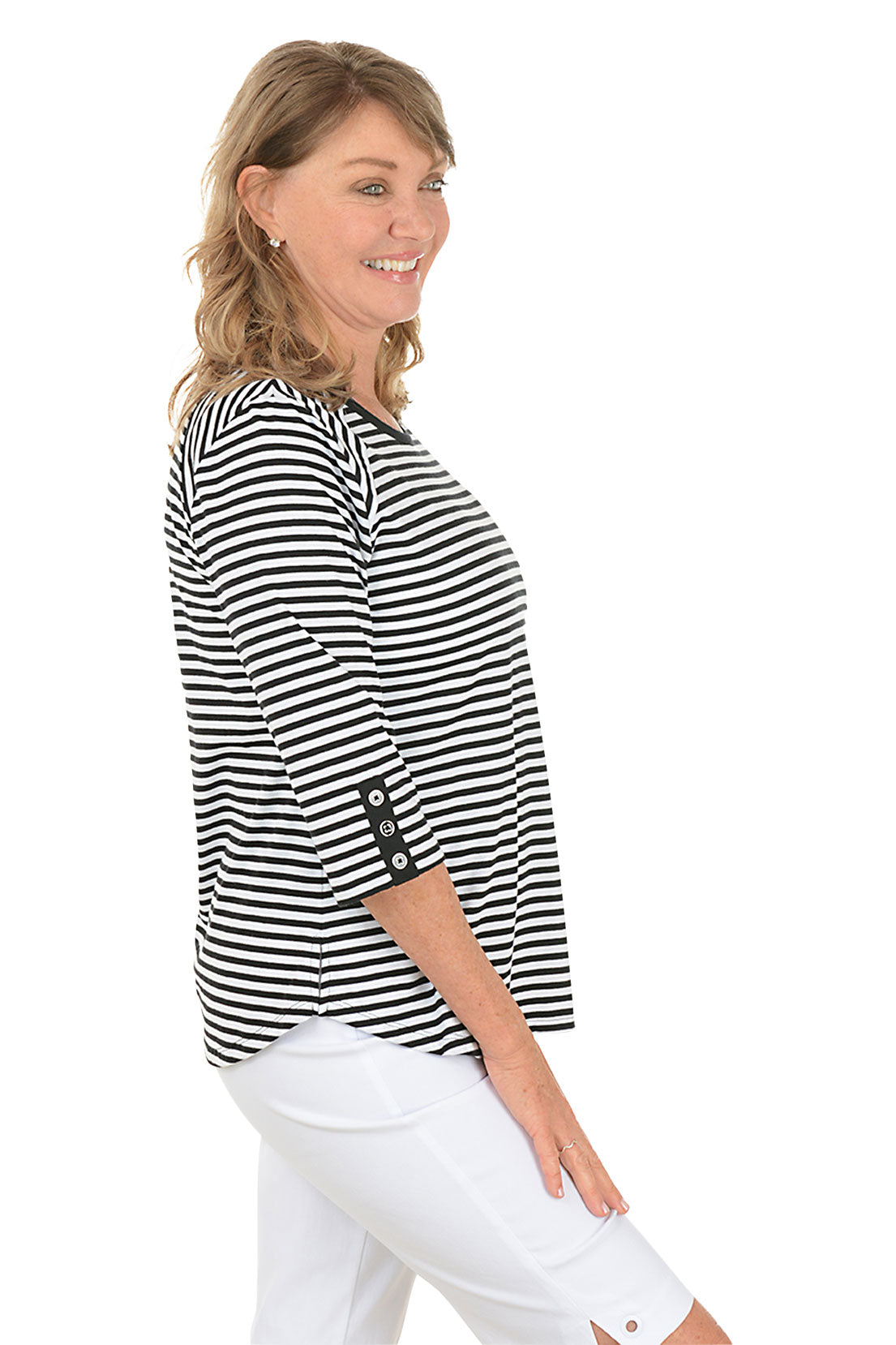 Woman wearing a black and white striped shirt on a white background. Side shot.