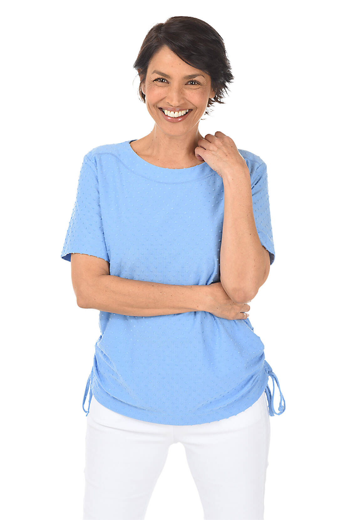 Woman wearing a light blue top with drawstring sides on a white background
