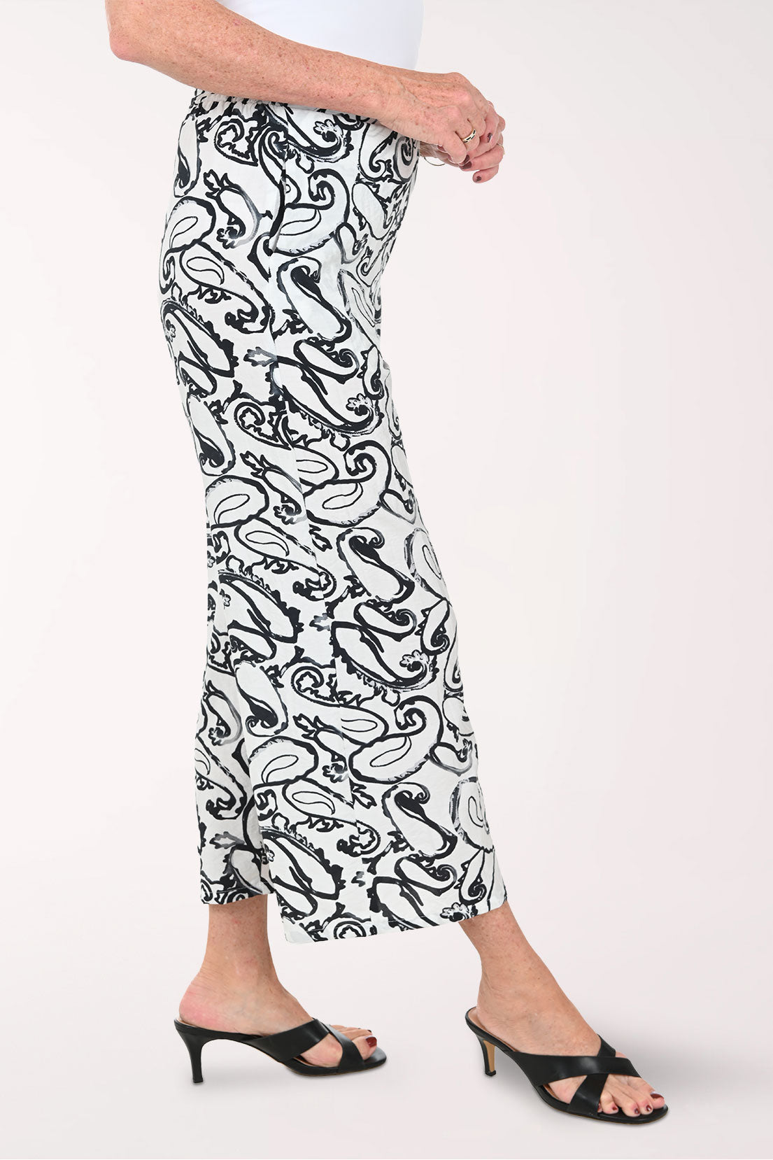 Woman wearing black and white paisley cropped bottoms
