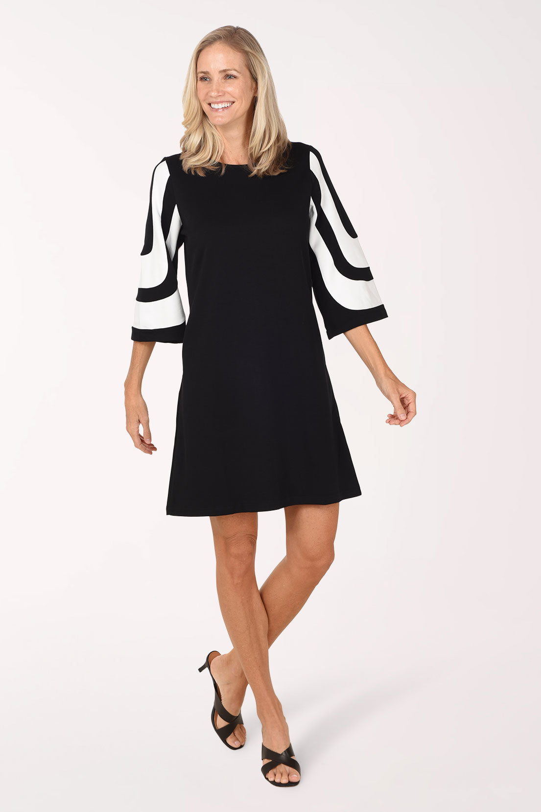 Front view of the Monochrome Mod Color Block Dress in motion, showing the A-line shape and above-the-knee length.