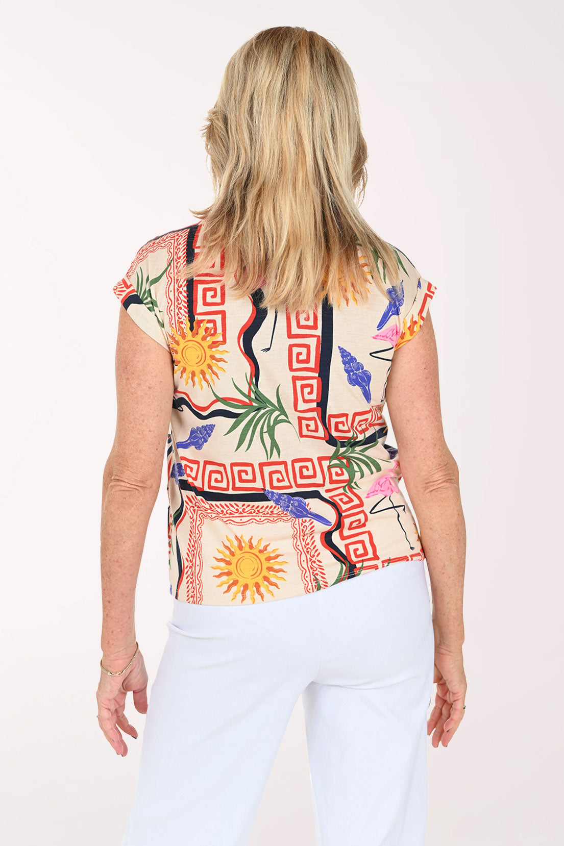 Woman wearing a tropical print short sleeve tee