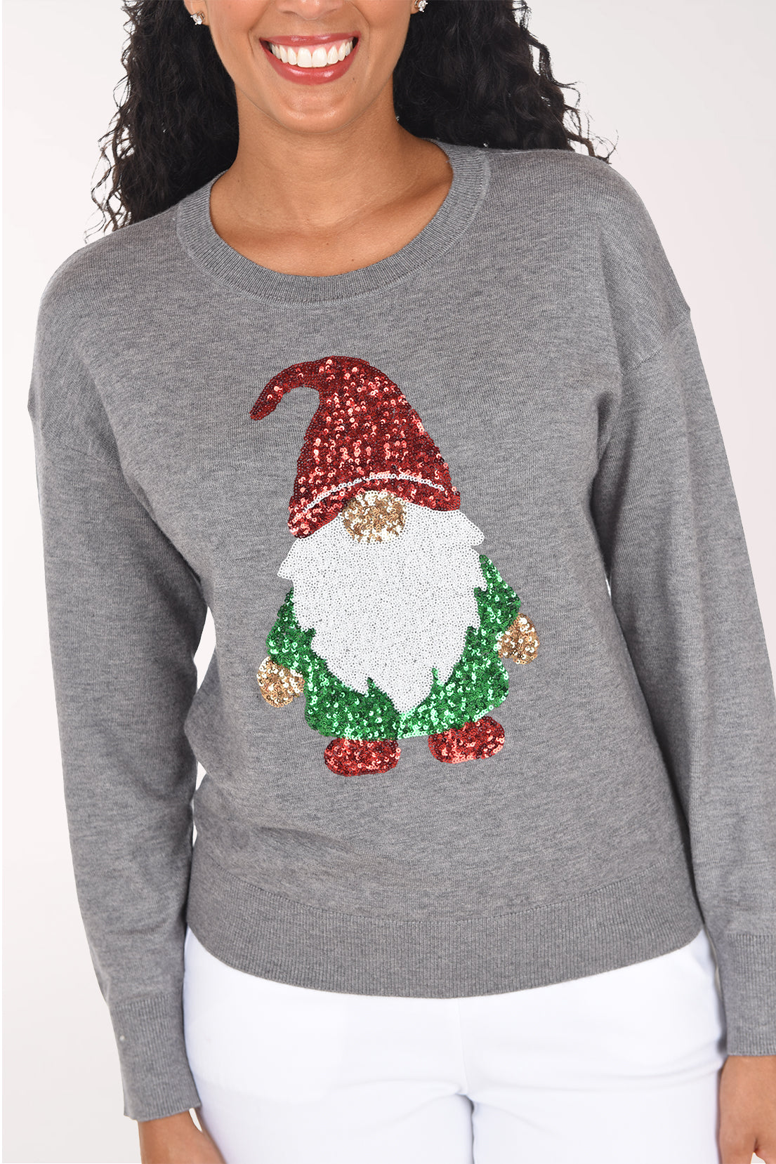 Close-up of the sequined gnome showing the red hat, textured white beard, gold hands and green coat.