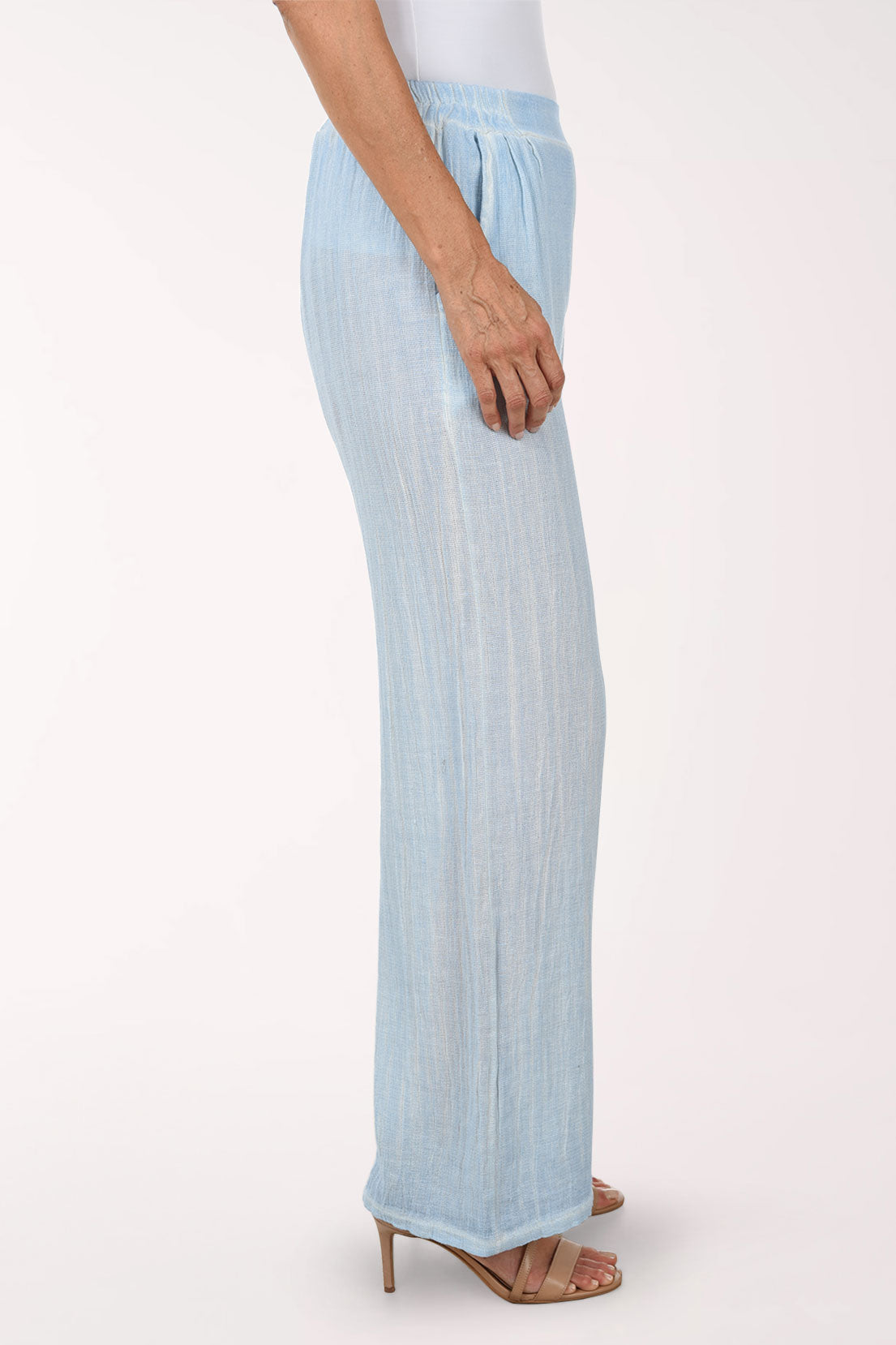 Light blue wide-leg pants worn by a person on a white background