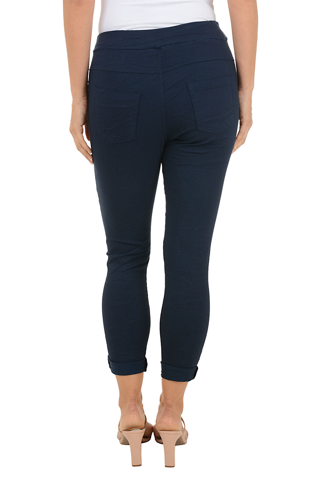 Navy blue pants with palm tree design on a white background. Back shot.