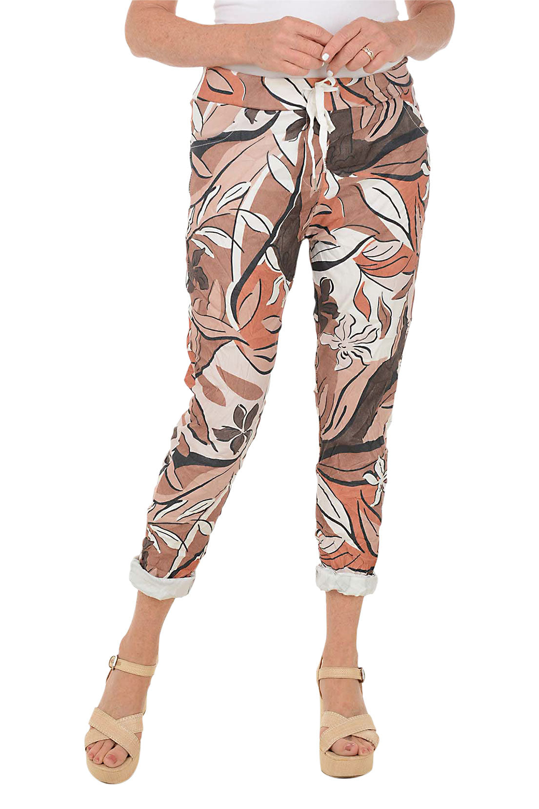Patterned pants worn by a person on a white background.