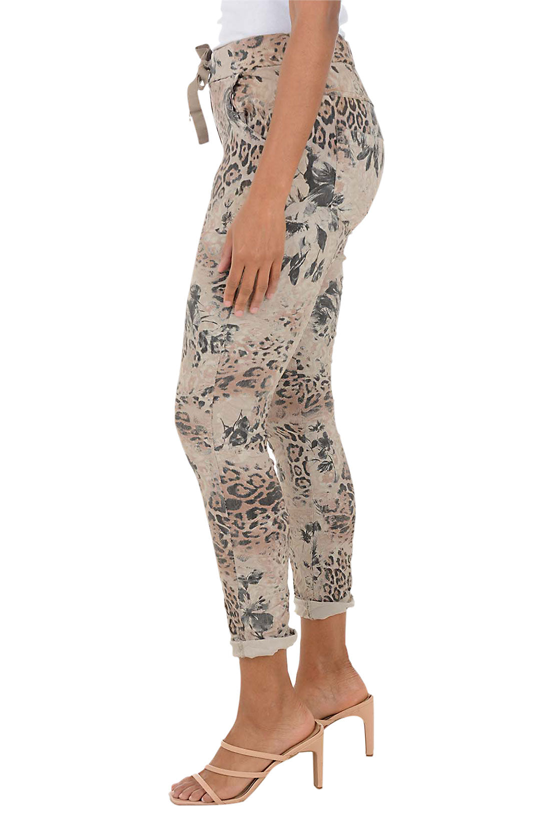Patterned pants worn by a person on a white background. Side shot.