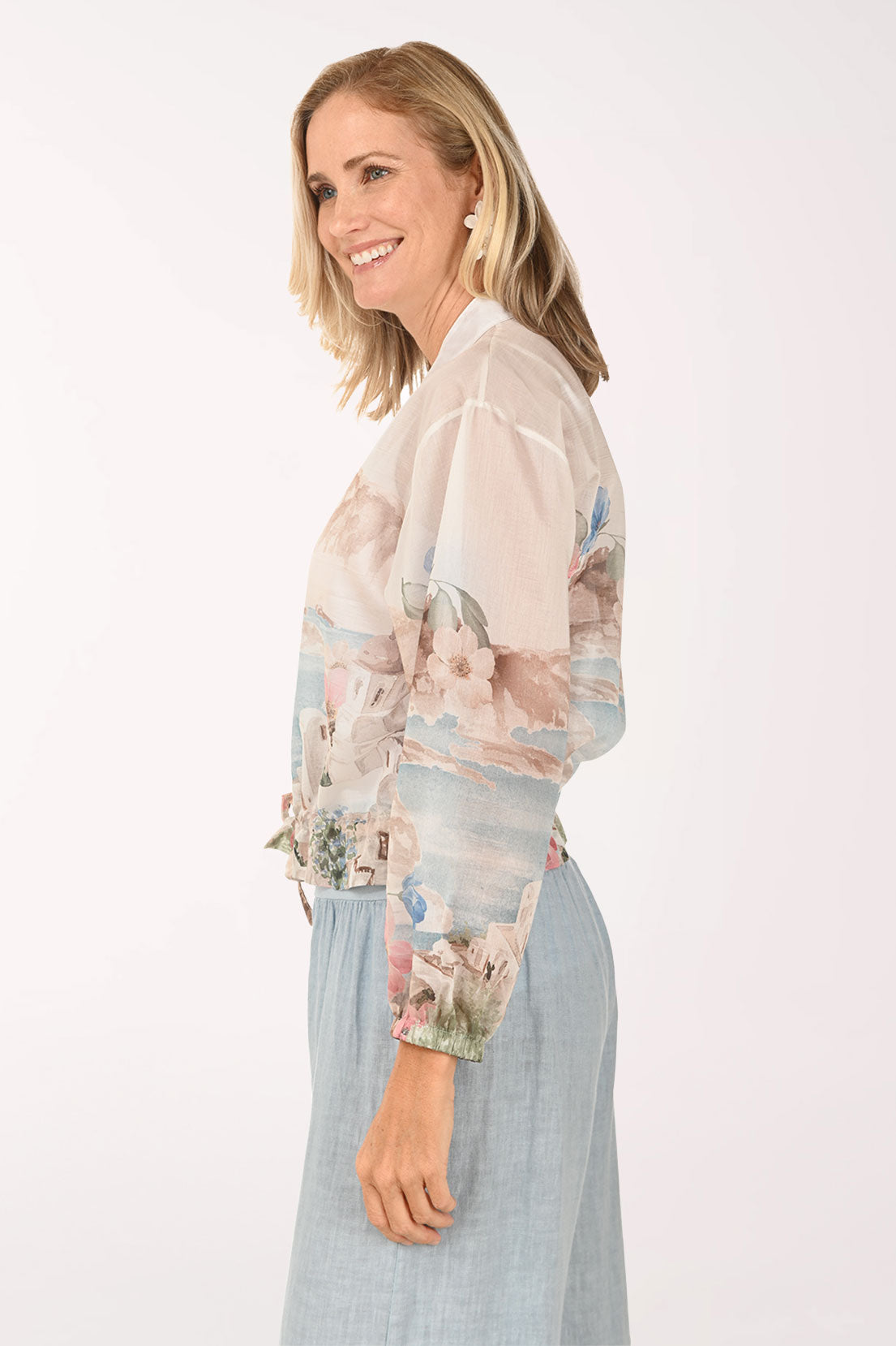 Woman wearing a beige floral jacket