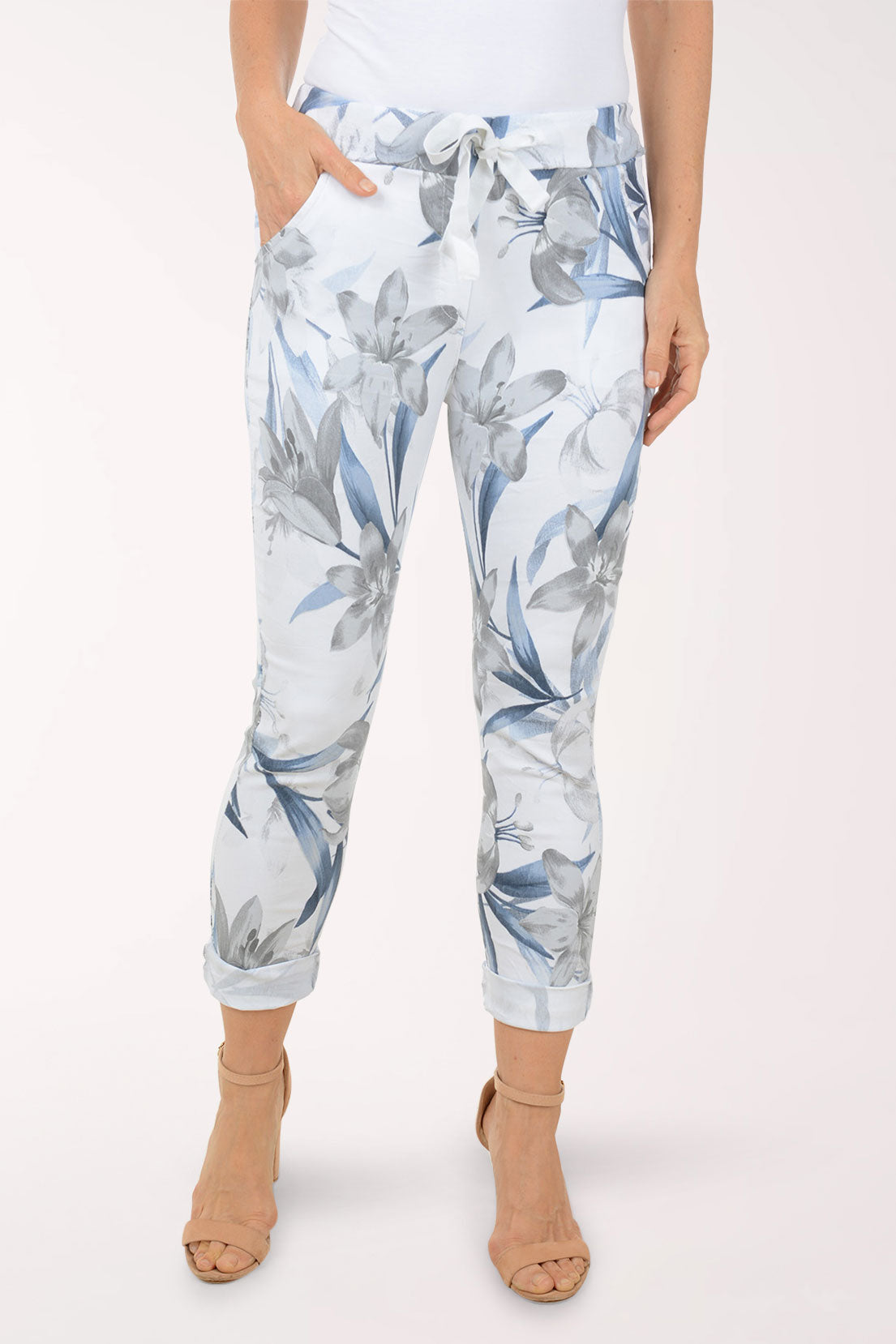 Woman wearing multicolored floral joggers.