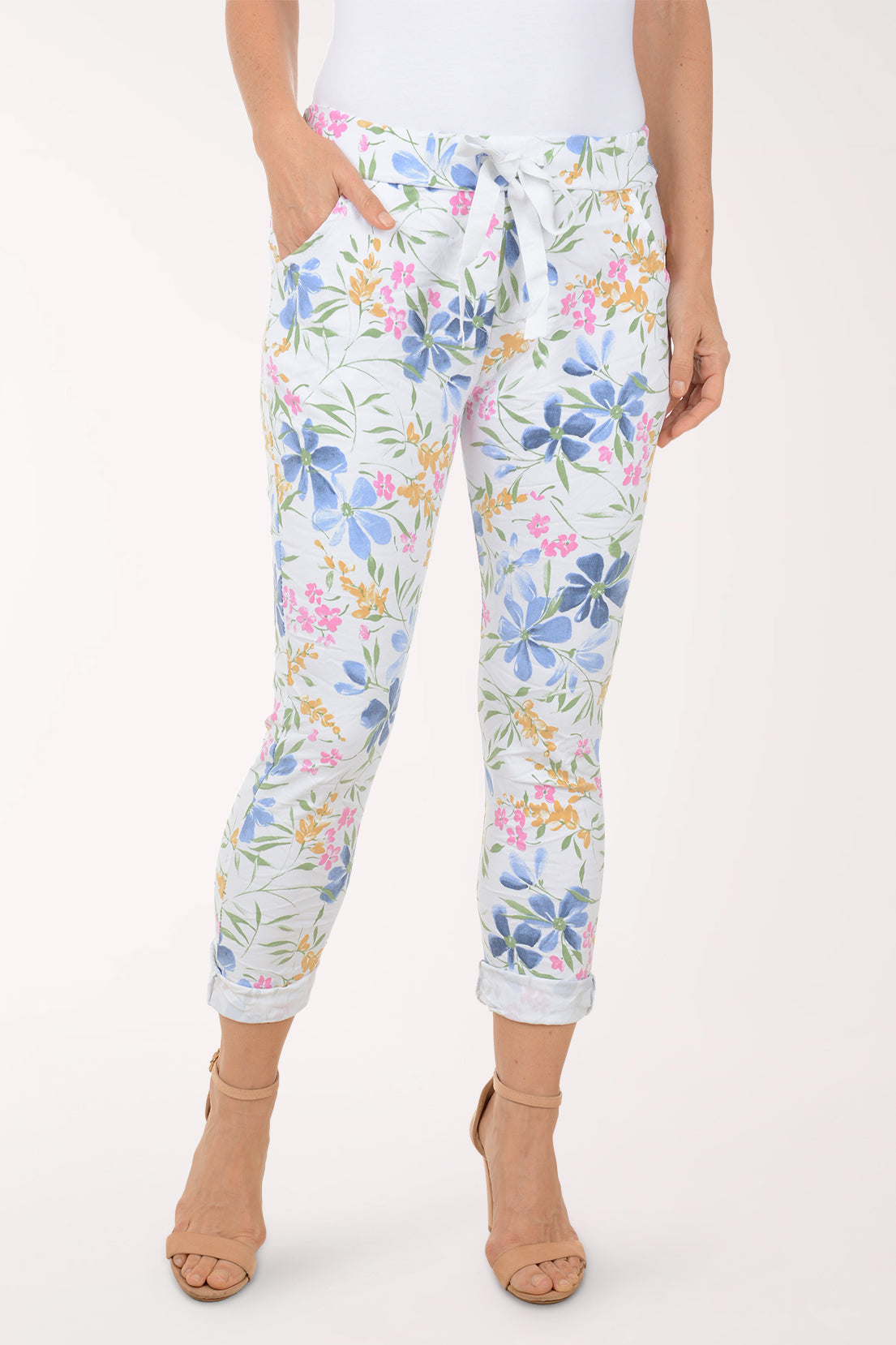 Woman wearing multicolored floral joggers.