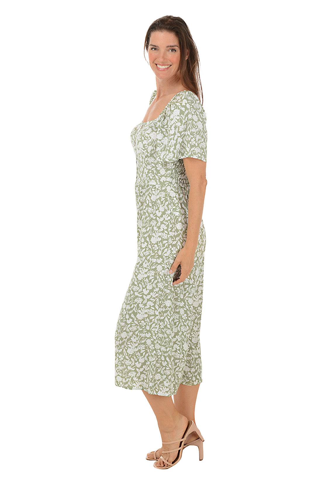 A side shot of a model wearing an olive floral square neck jumpsuit with short flutter sleeves and wide legs.