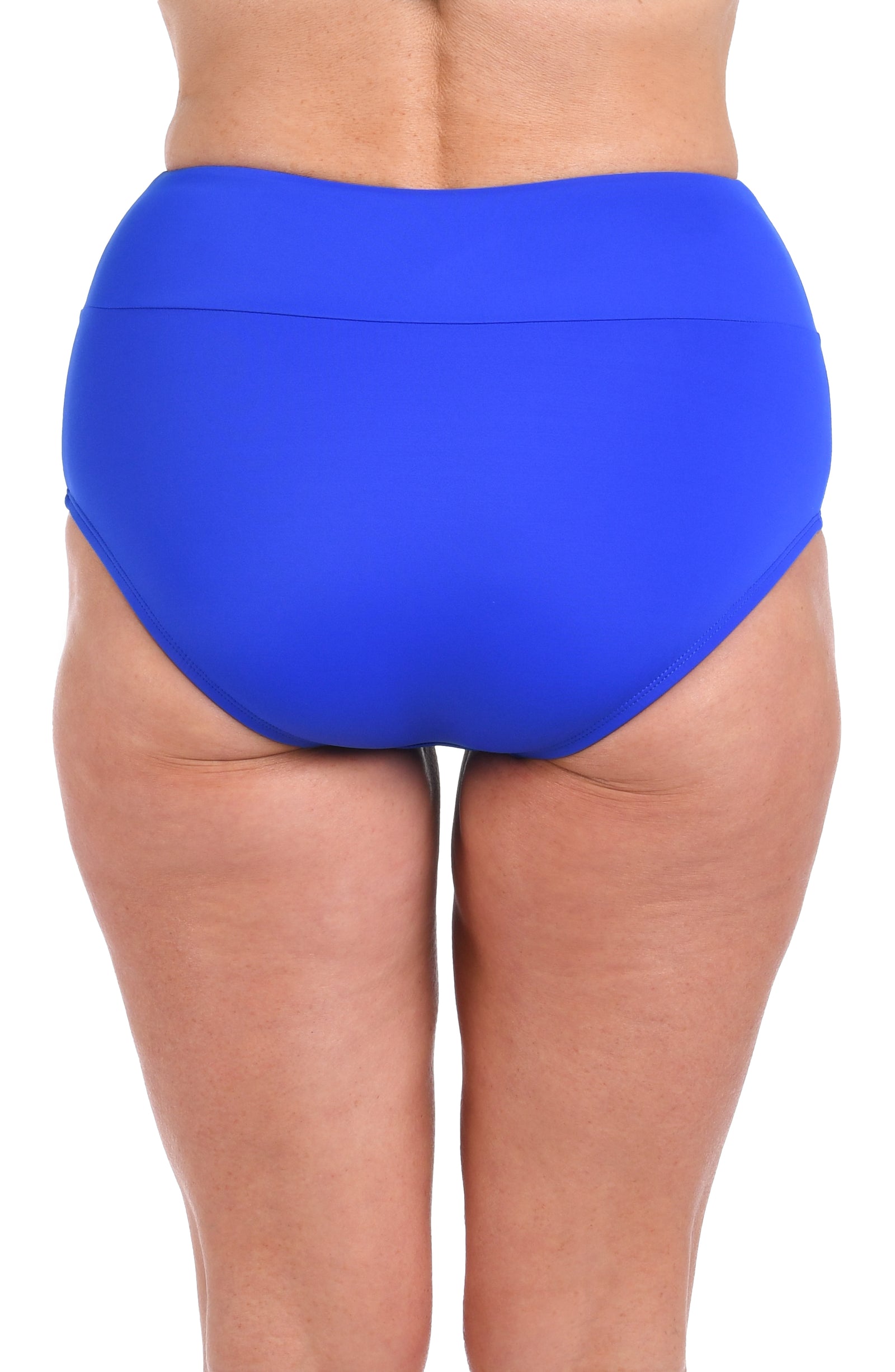 A rear view of a woman wearing a bright blue swim brief against a light colored background