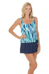 A woman wearing a blue swim dress.