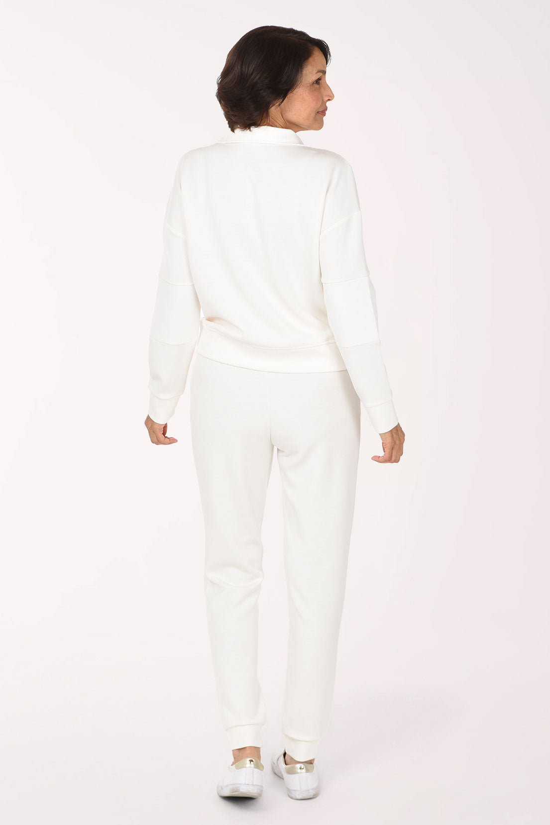 Woman wearing a matching white lounge set