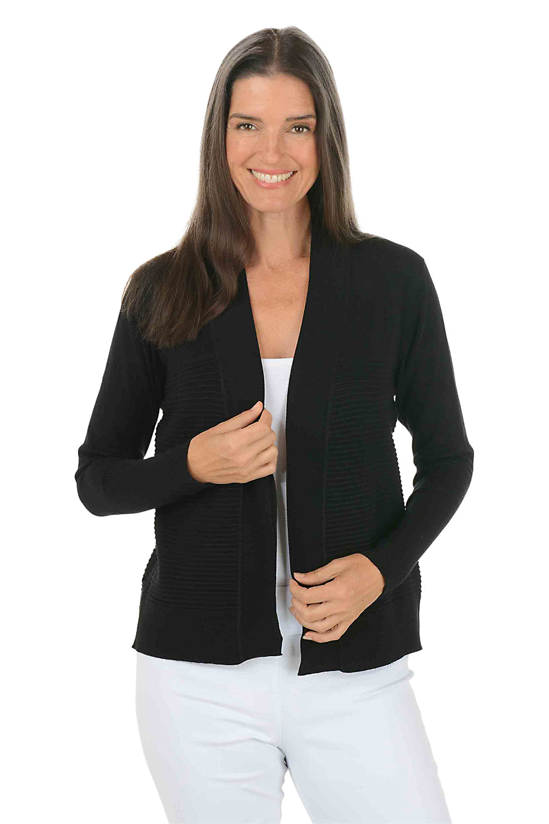 Woman wearing a black cardigan over a white top on a white background.