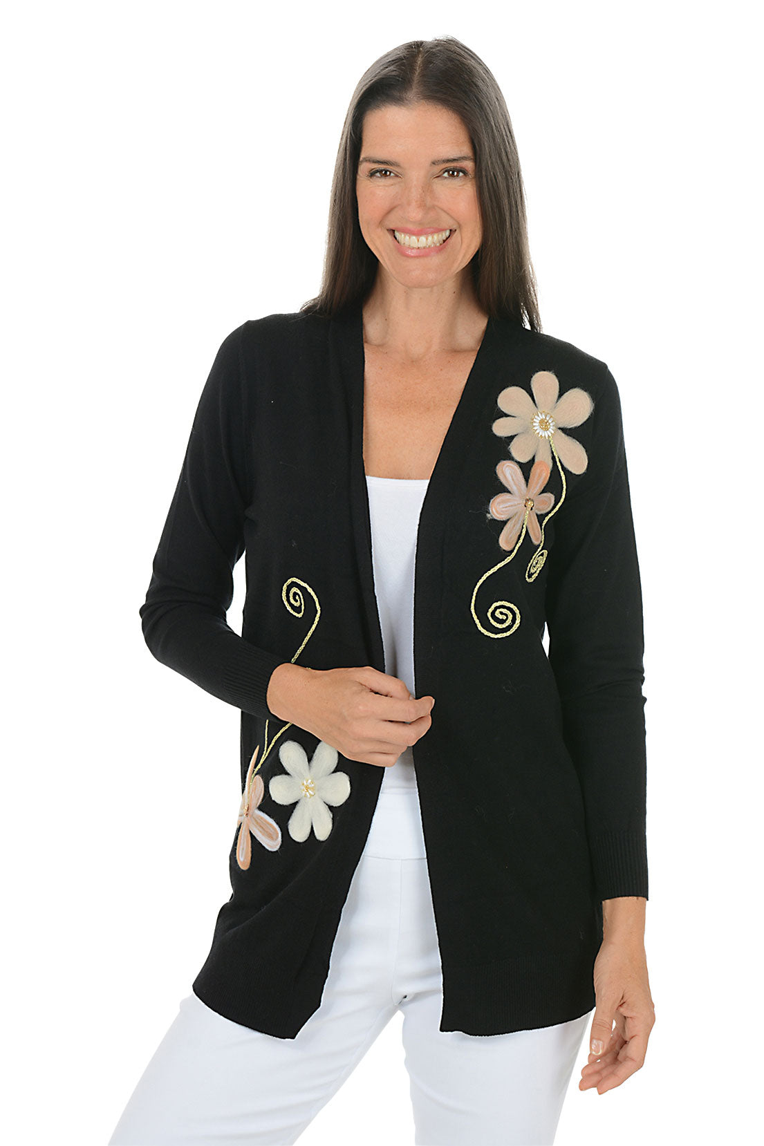 Woman wearing a black cardigan with gold floral designs on a white background.