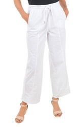 A front shot of a model wearing a white wide-leg pants
