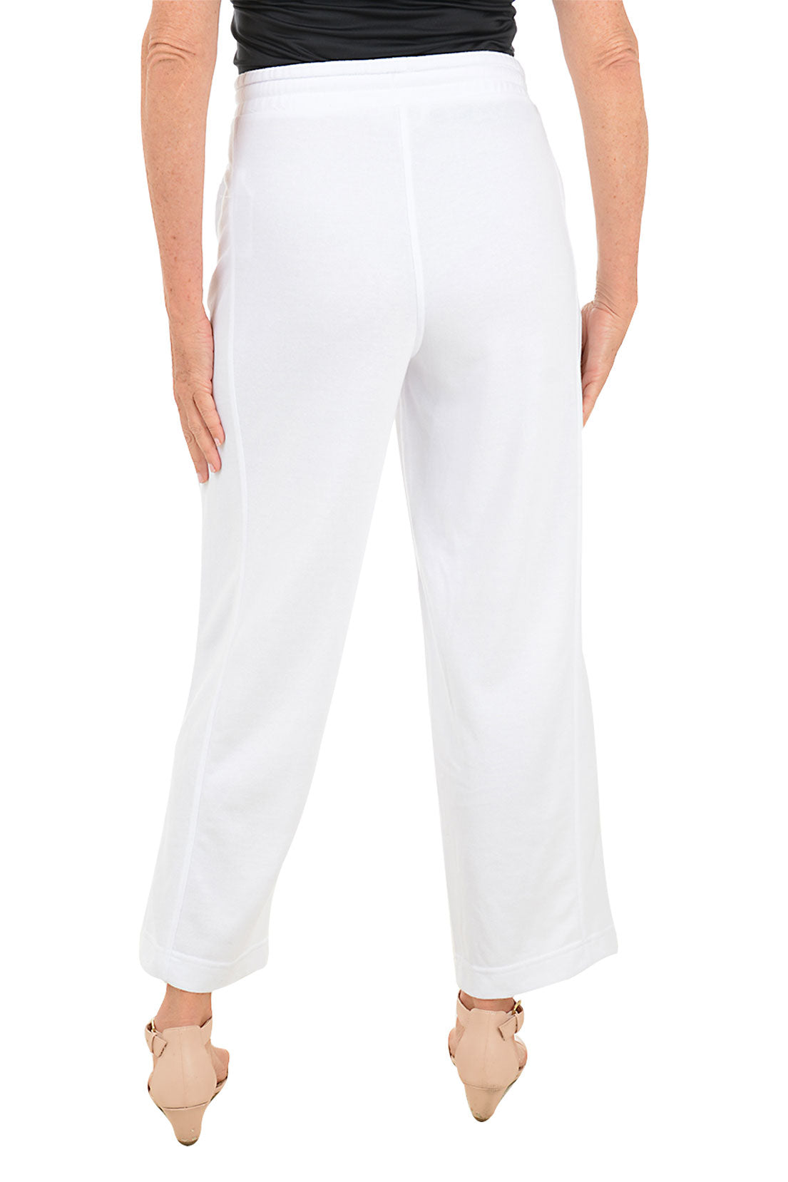 A back shot of a model wearing a white wide-leg pants