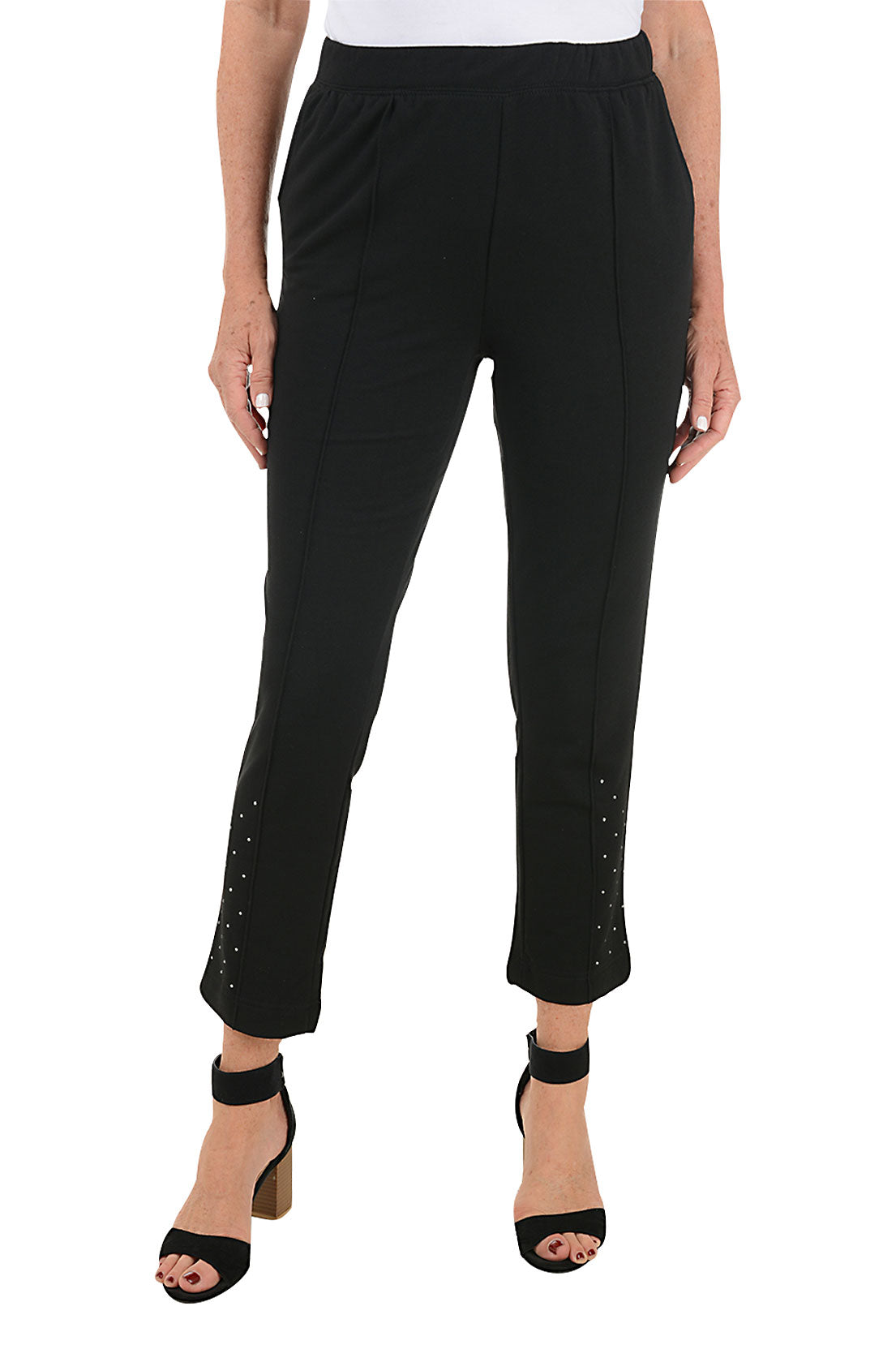 A front shot of a model wearing a ankle-length black lounge pants with pintuck detail on the front leg and rhinestone embellishment near the hemline, featuring a stretch waistband and dual front pockets.