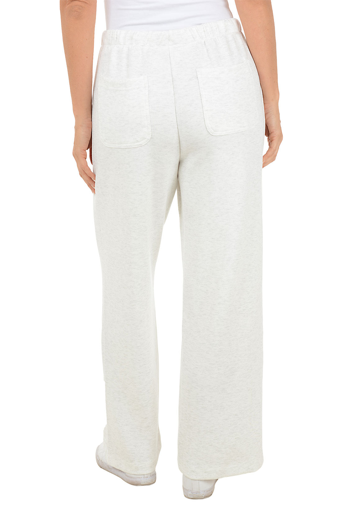 White wide leg sweat pants worn by a person on a white background. Back shot.