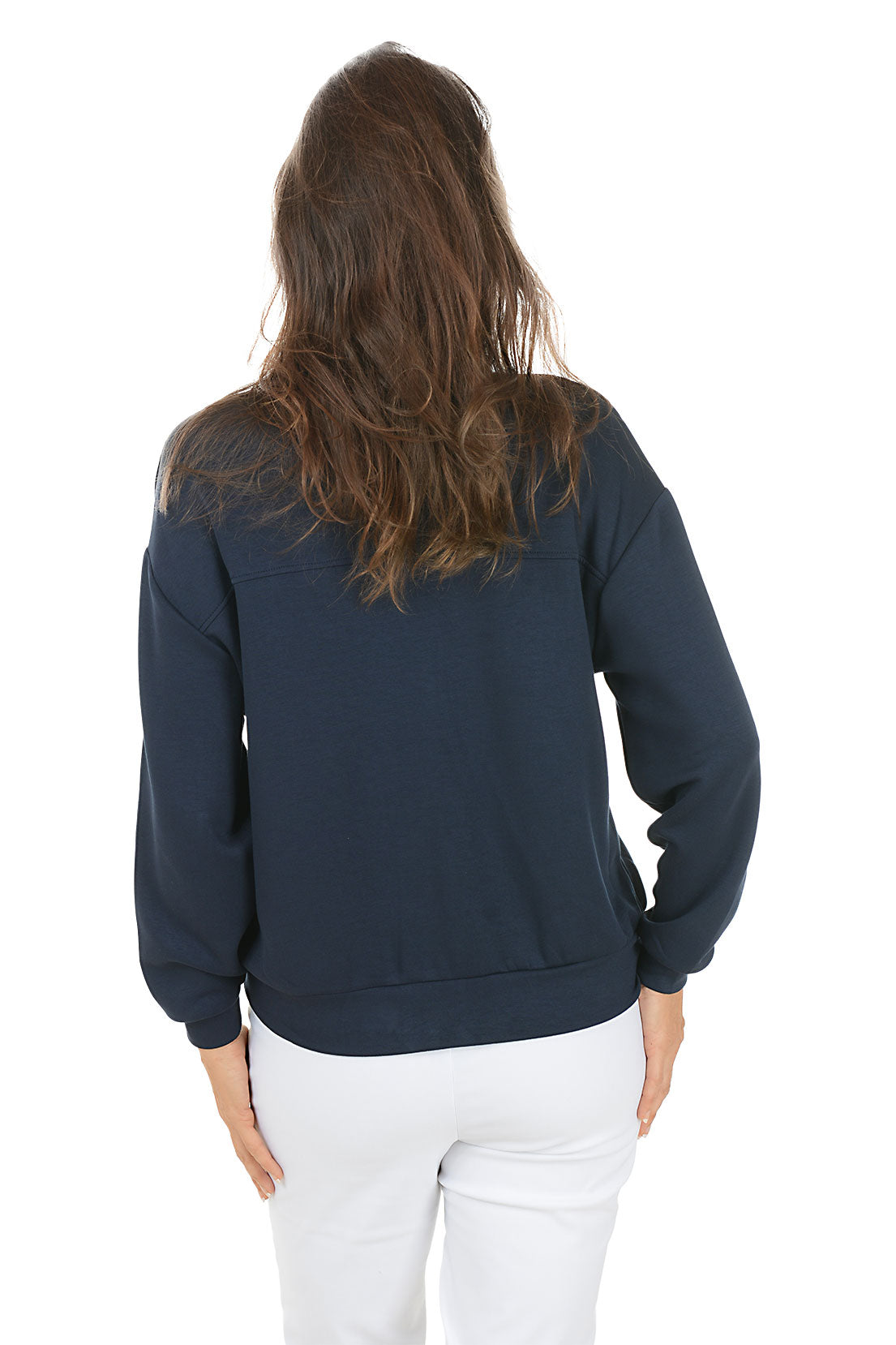 Woman wearing a navy blue jacket with gold buttons on a white background. Back shot.