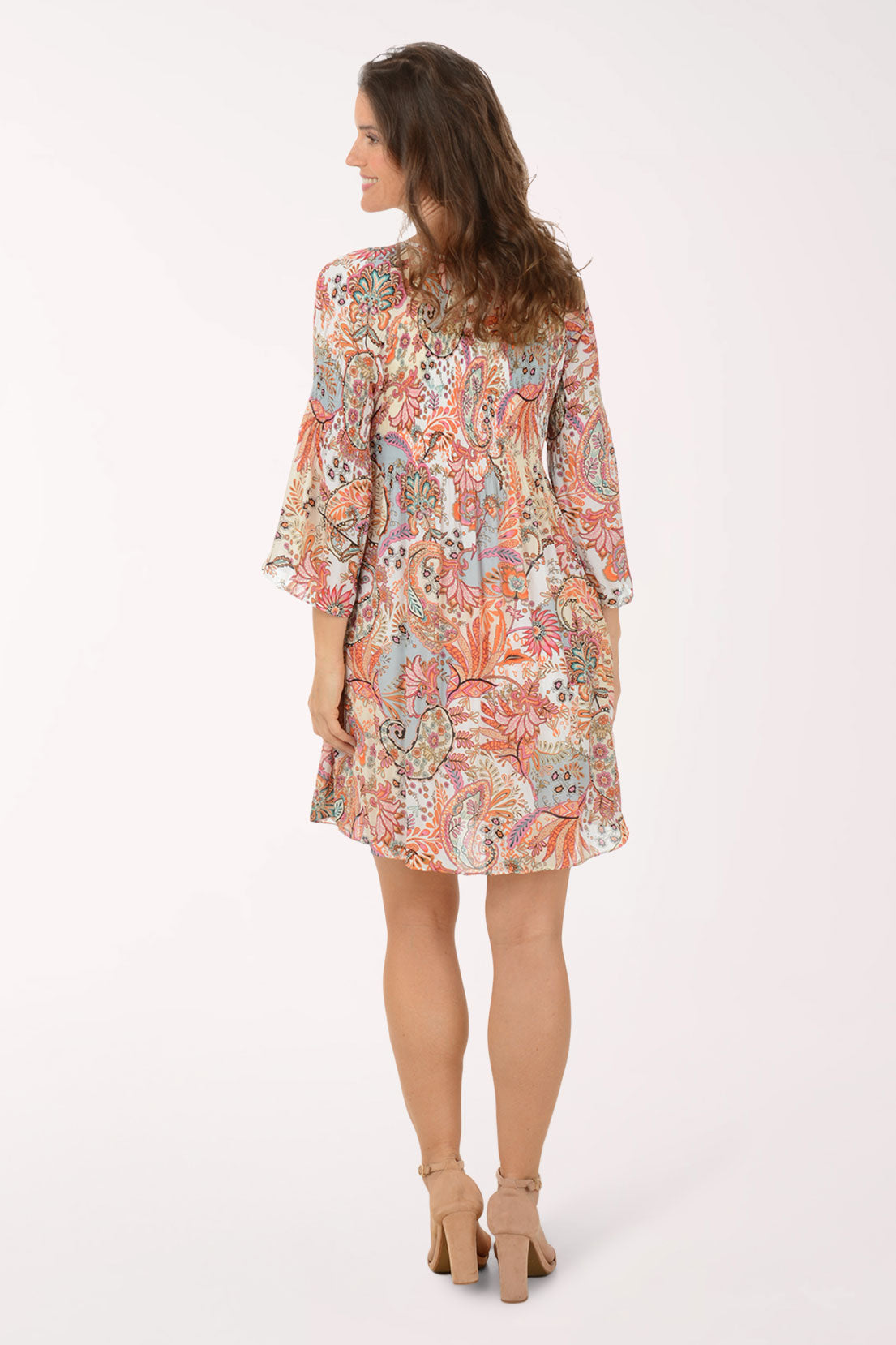 Woman wearing a floral dress on a white background