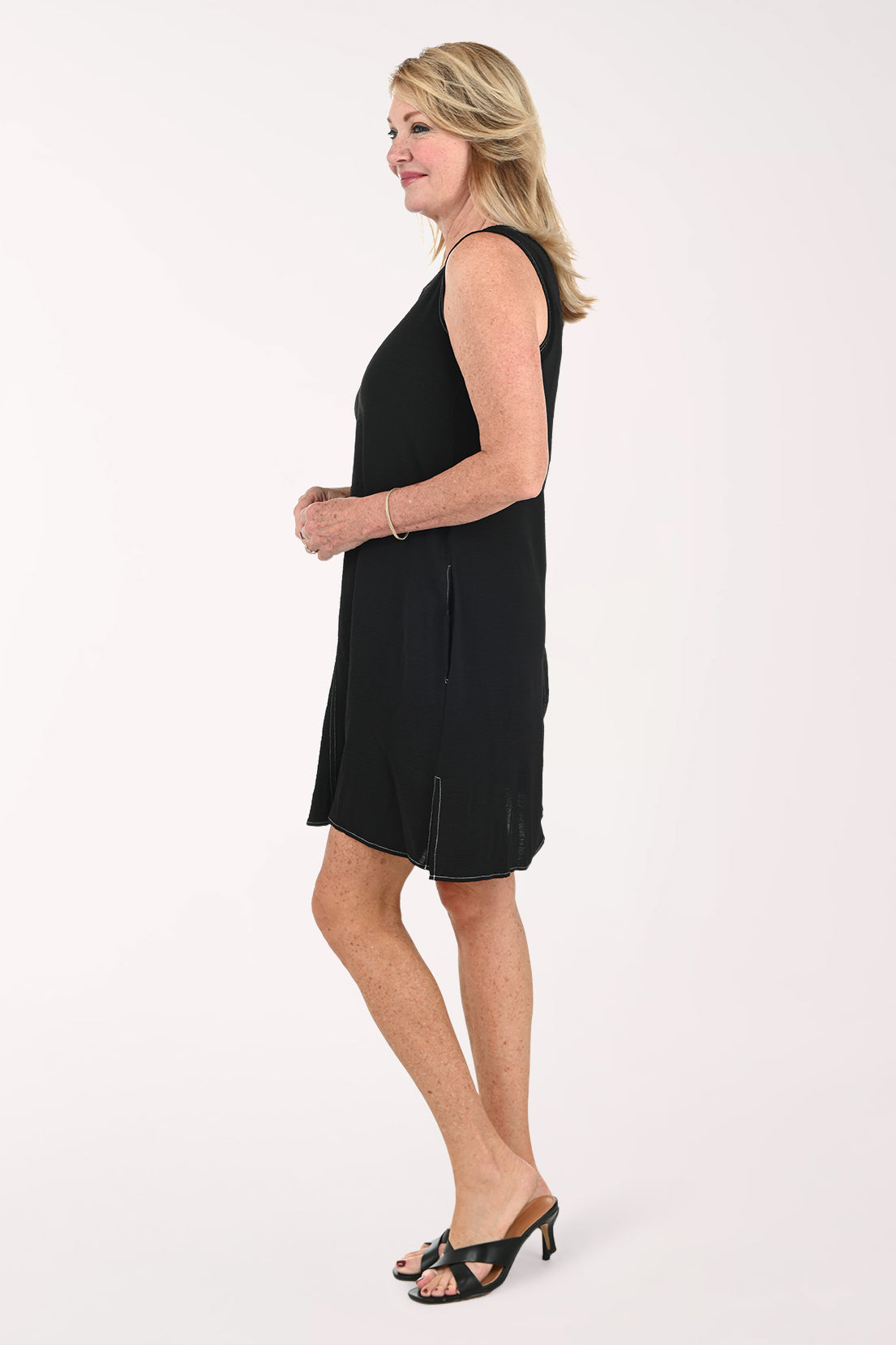 Woman wearing a sleeveless black dress
