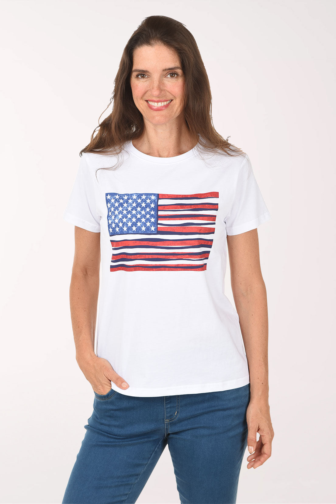 Woman wearing a white t-shirt with an American flag design on a plain background
