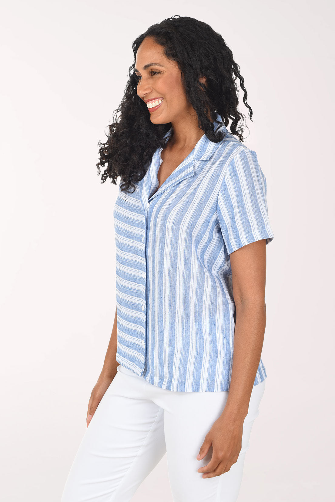 Woman wearing a blue and white striped shirt on a white background