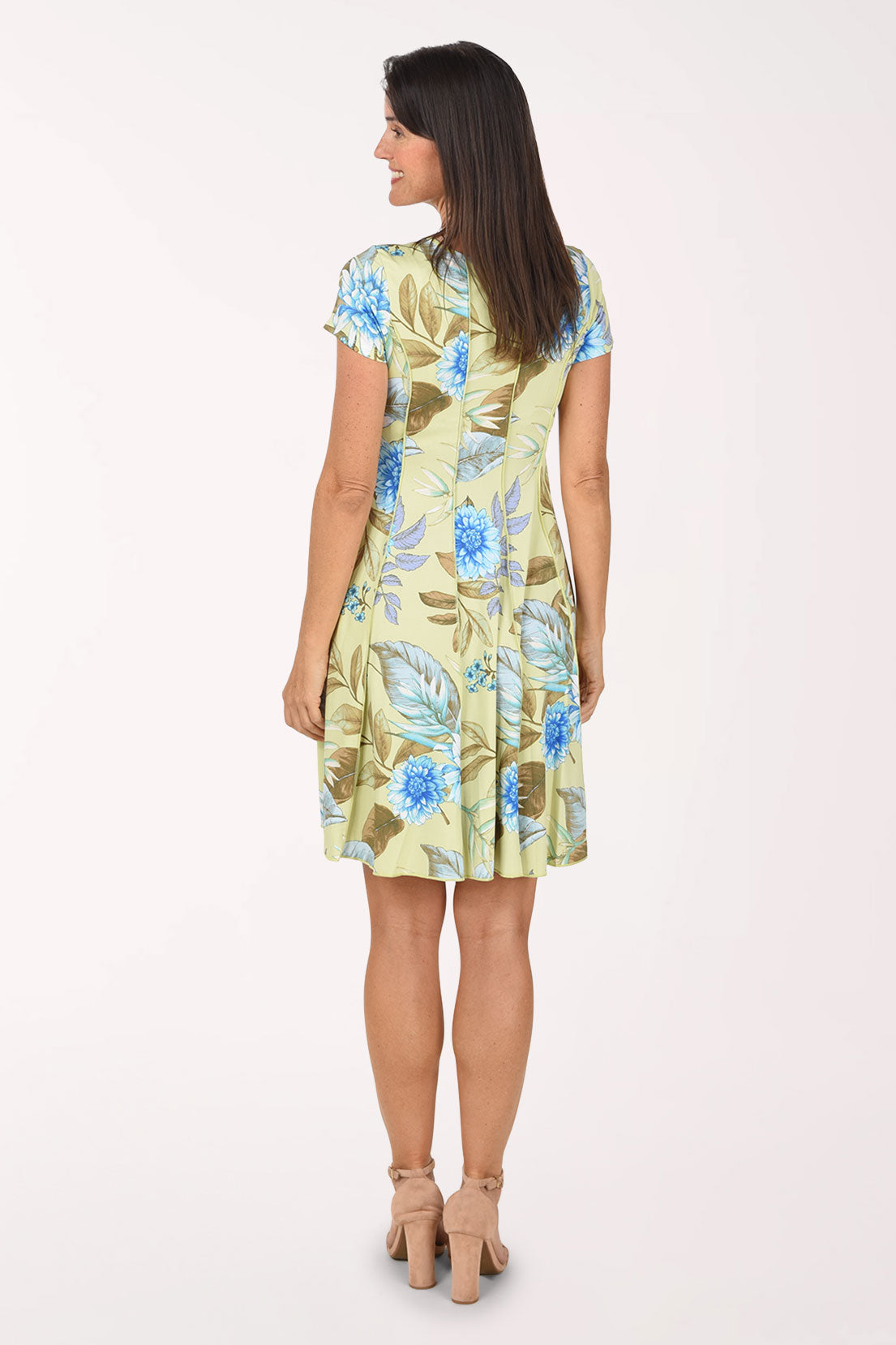 Back view of the Sunshine Sage Seamed Dress showing the all-over floral and leaf print.