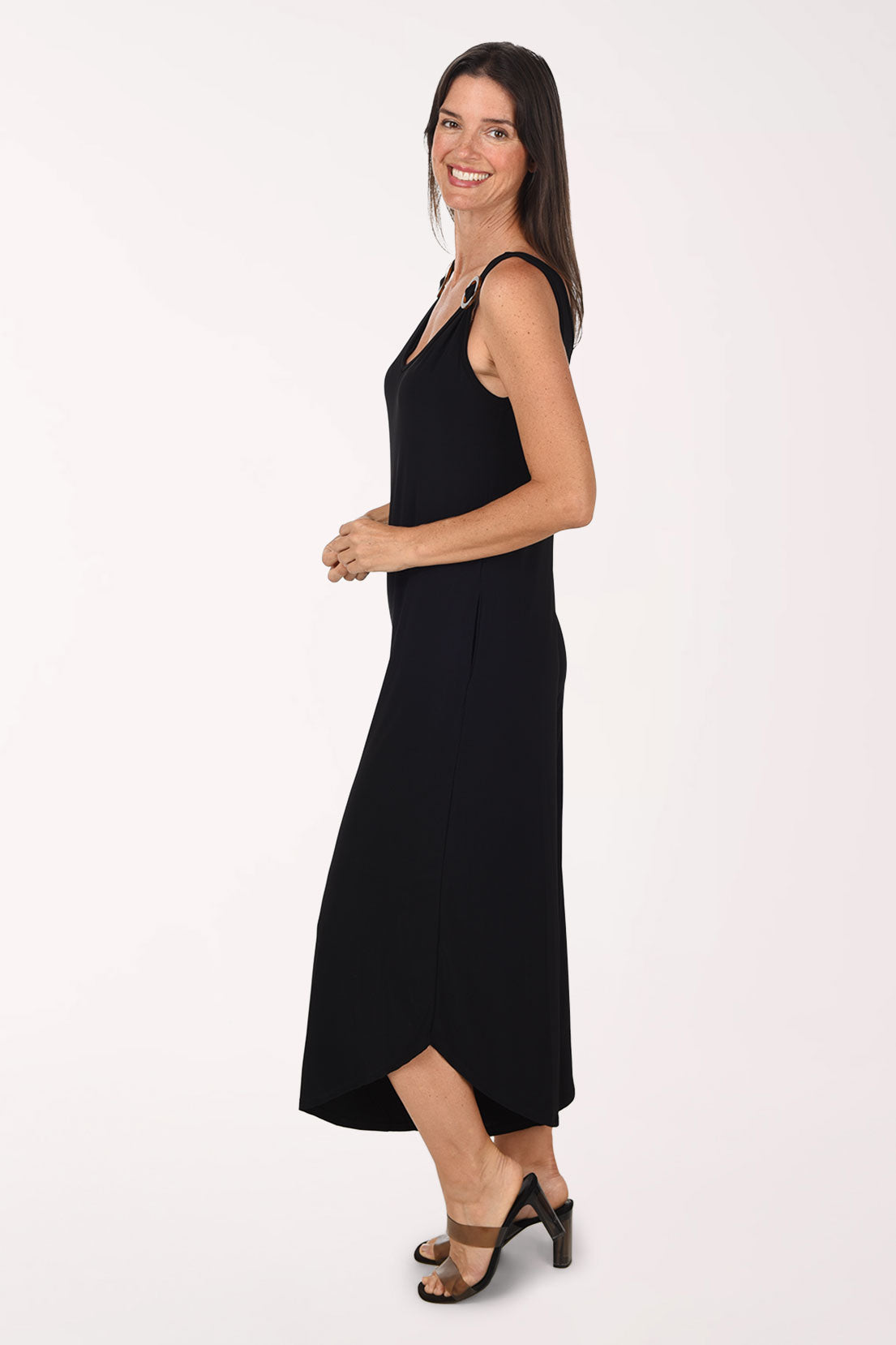 Side view of the black Ringed Strap Jumpsuit showing the wide cropped leg and curved, angled hem.
