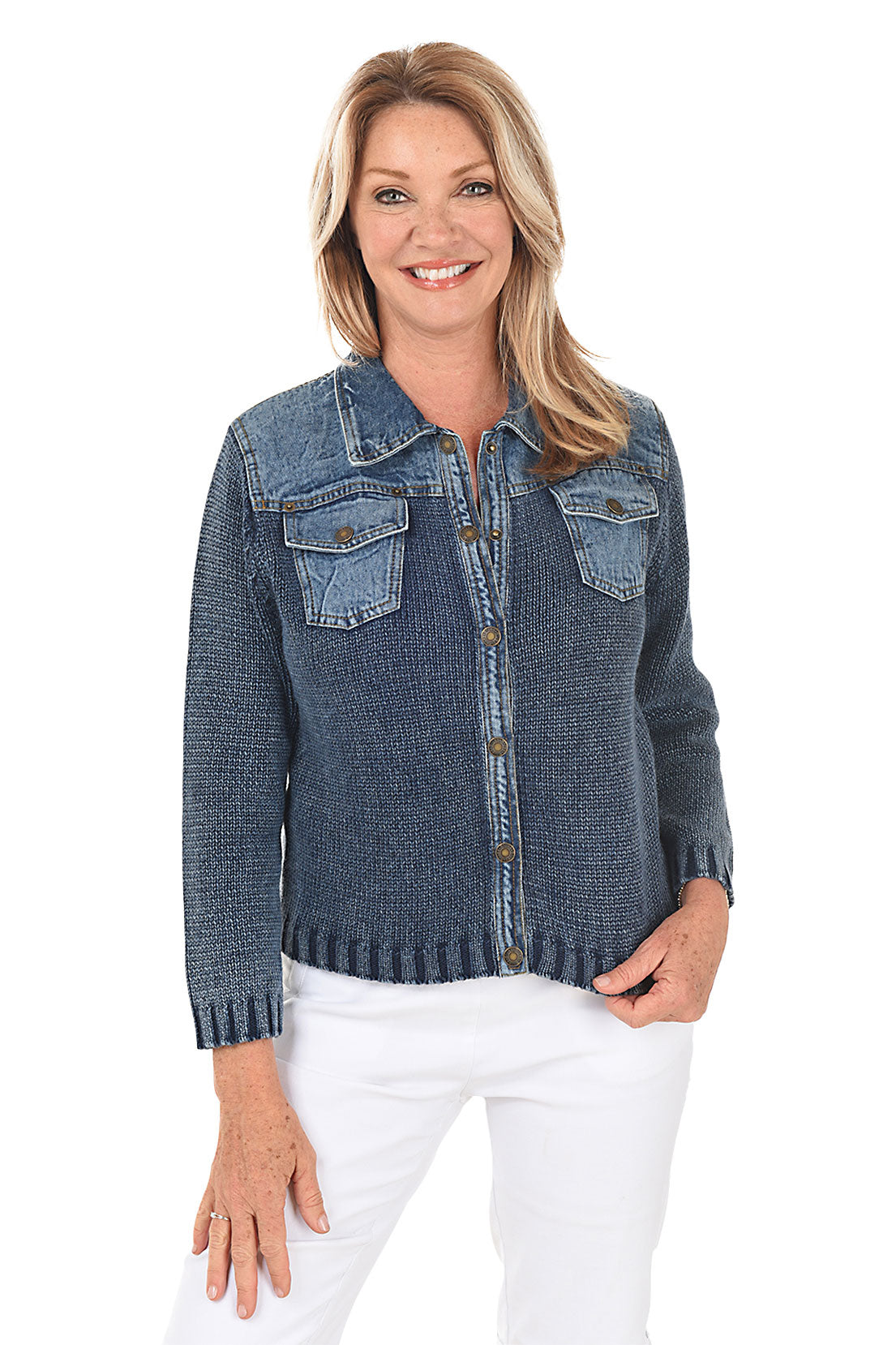 Woman wearing a blue denim sweater jacket on a white background.