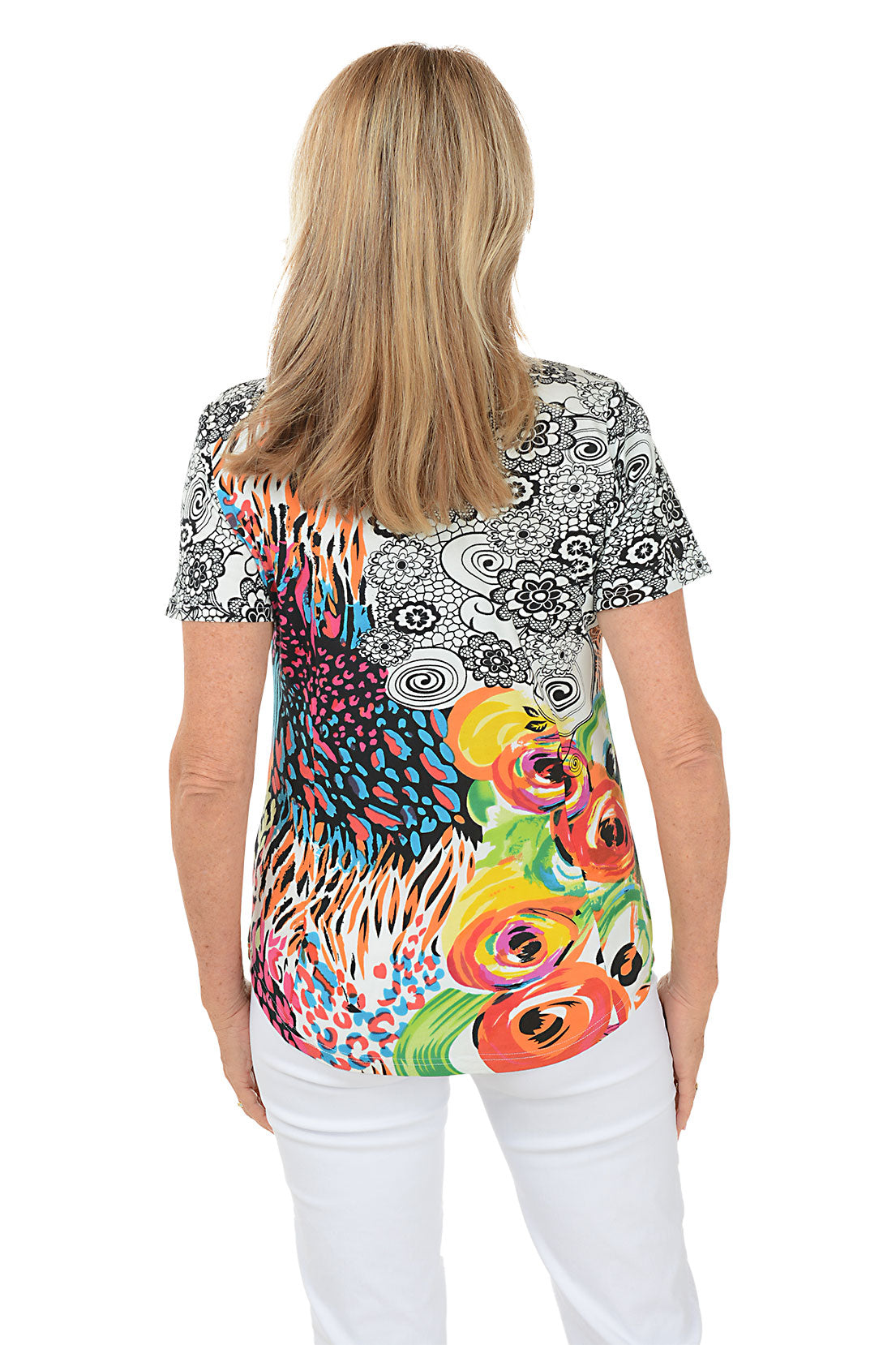 A back shot of a model wearing a short sleeve t-shirt with a geometric and floral pattern, in a multicolor print.