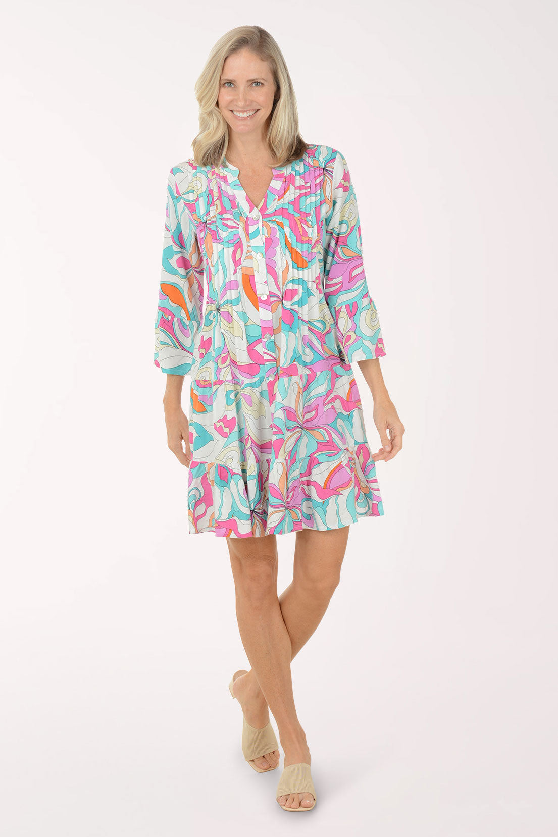 Woman wearing a colorful dress with a white background