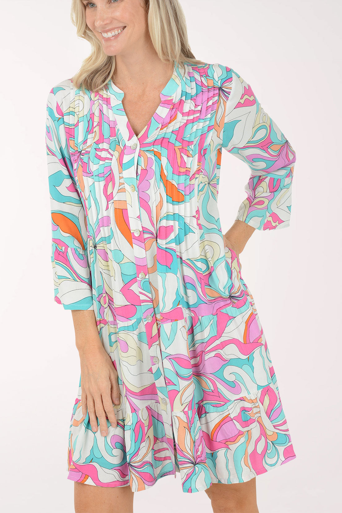 Woman wearing a colorful dress with a white background