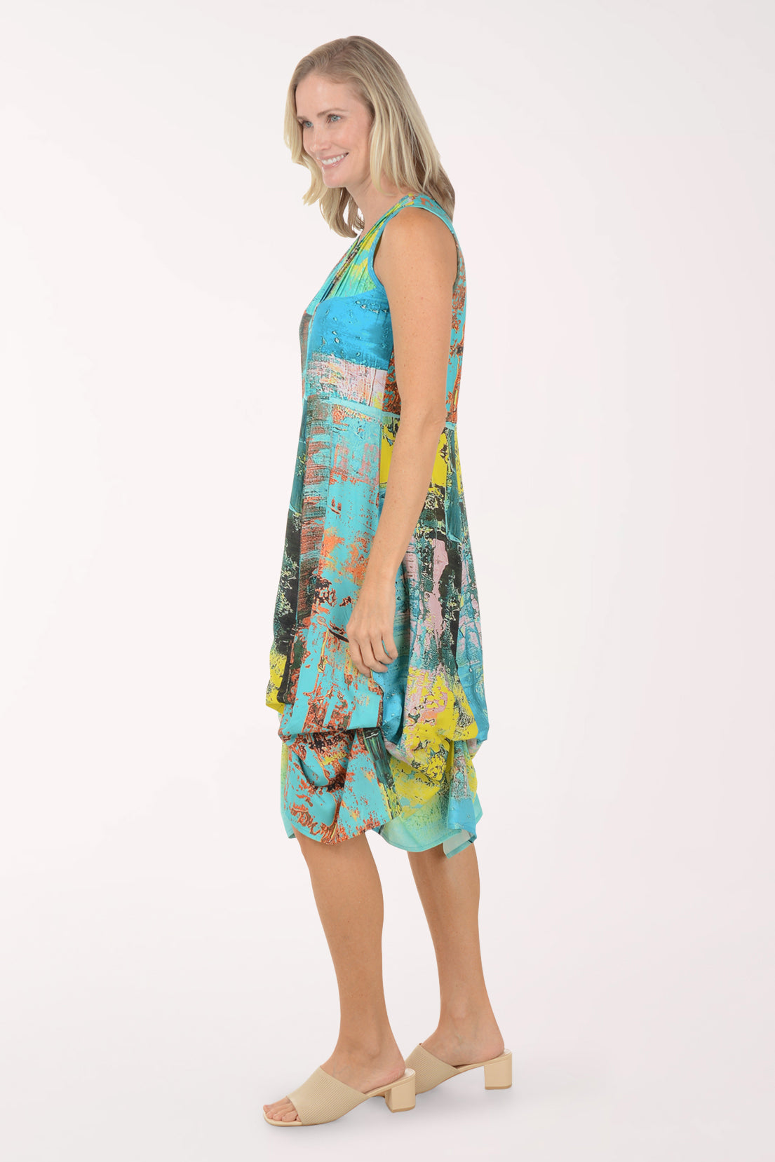 Woman wearing a colorful dress on a white background