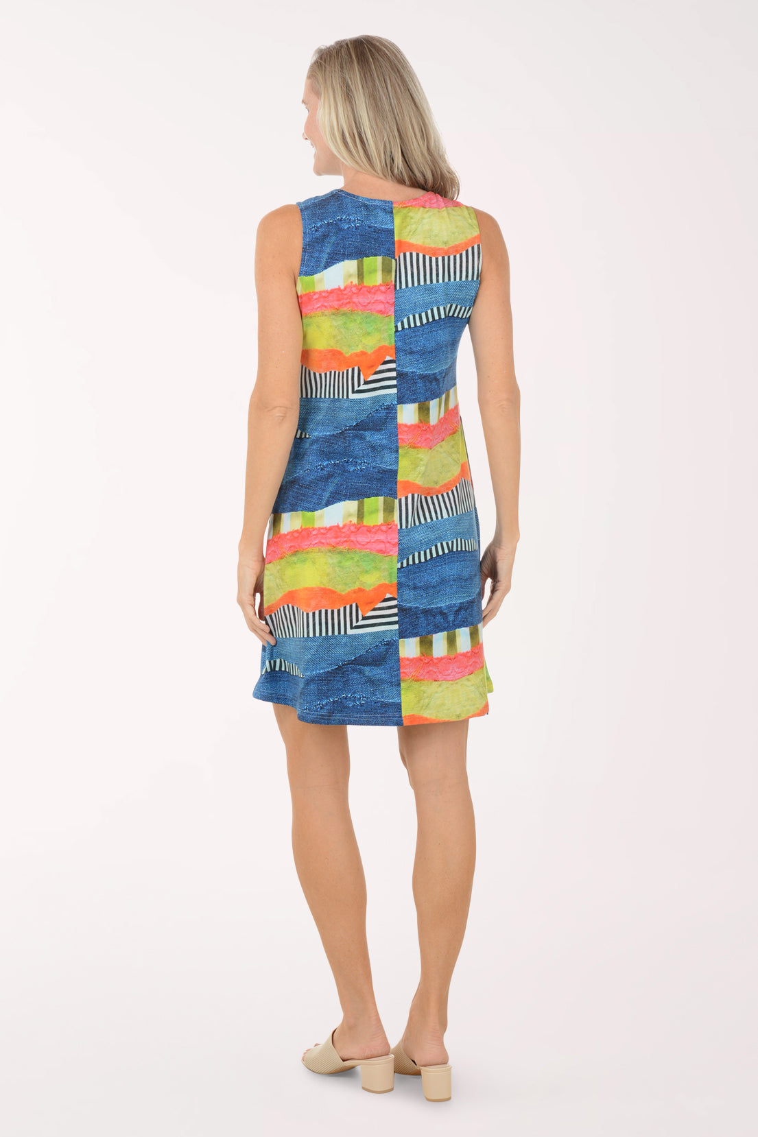 Woman wearing a colorful dress with a white background