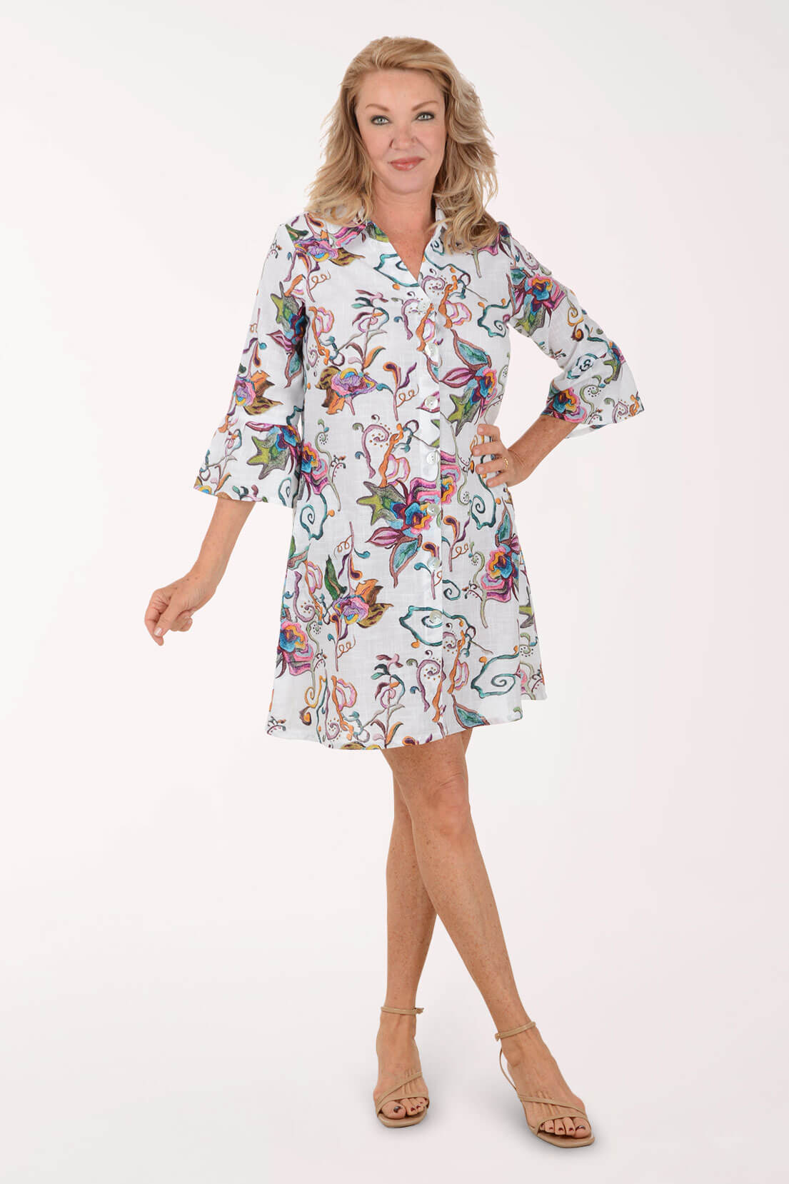 Woman wearing a floral dress on a white background